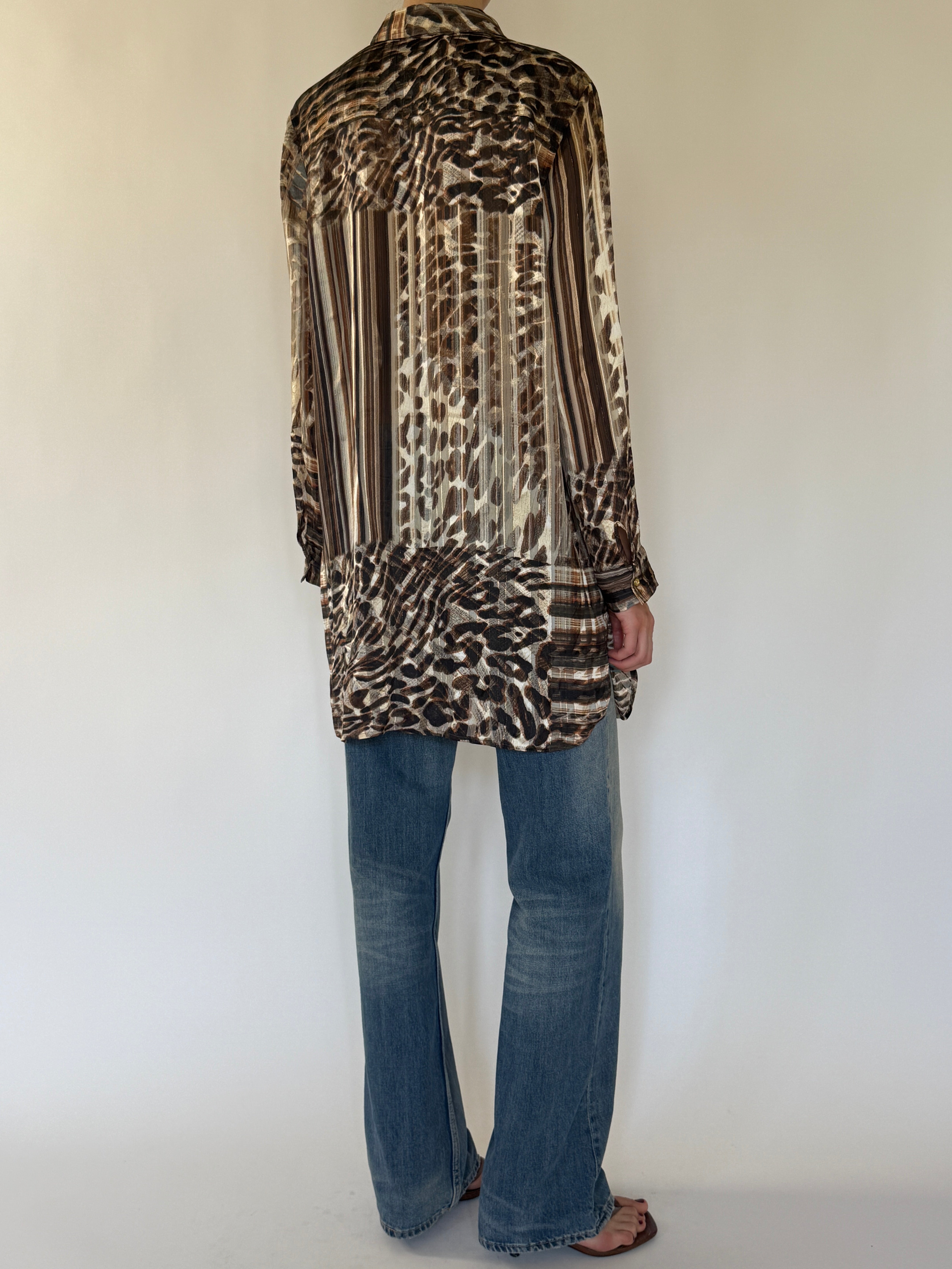 Vintage brown animal print shirt fabric close-up