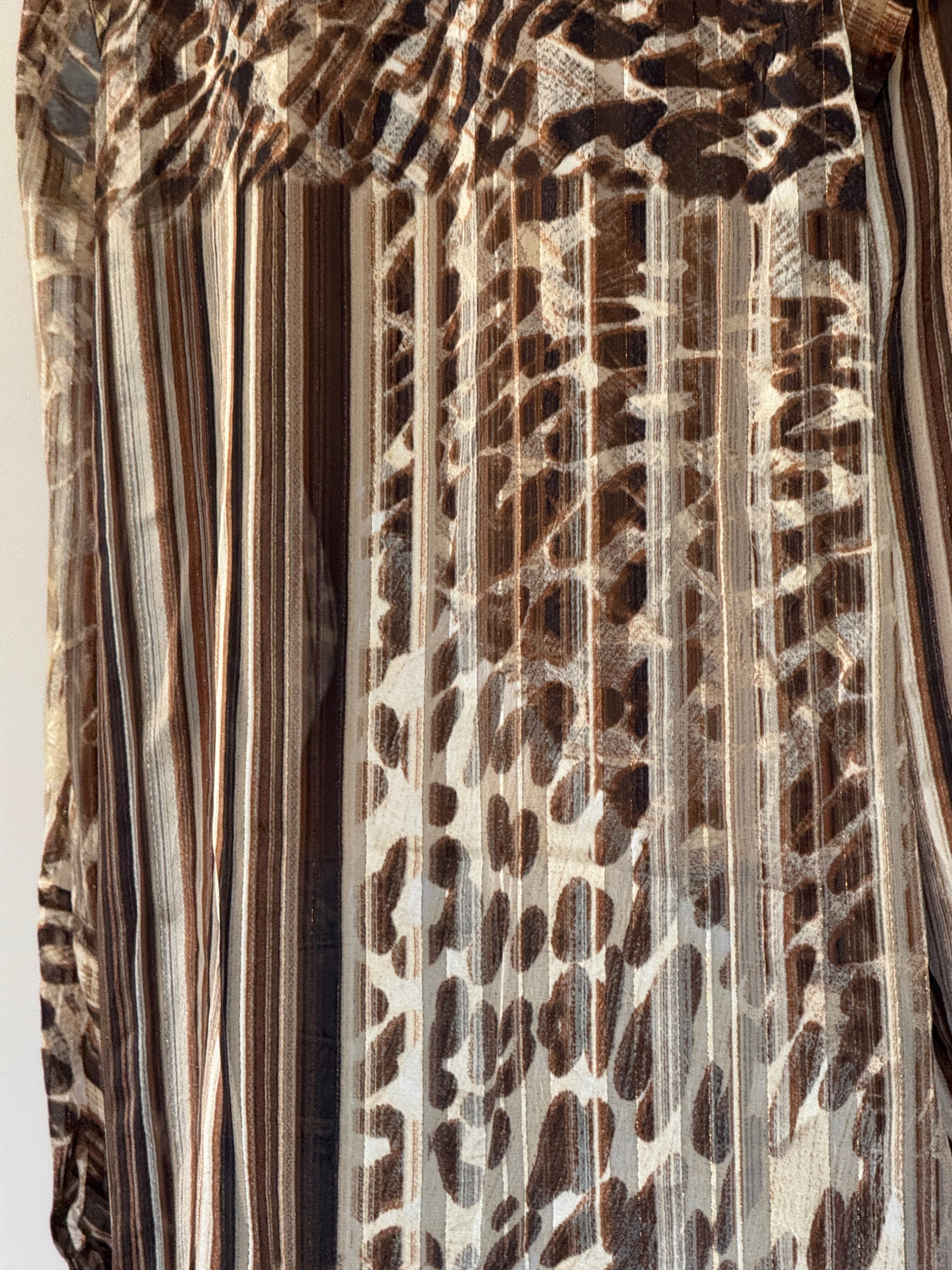 Vintage brown animal print shirt fabric close-up