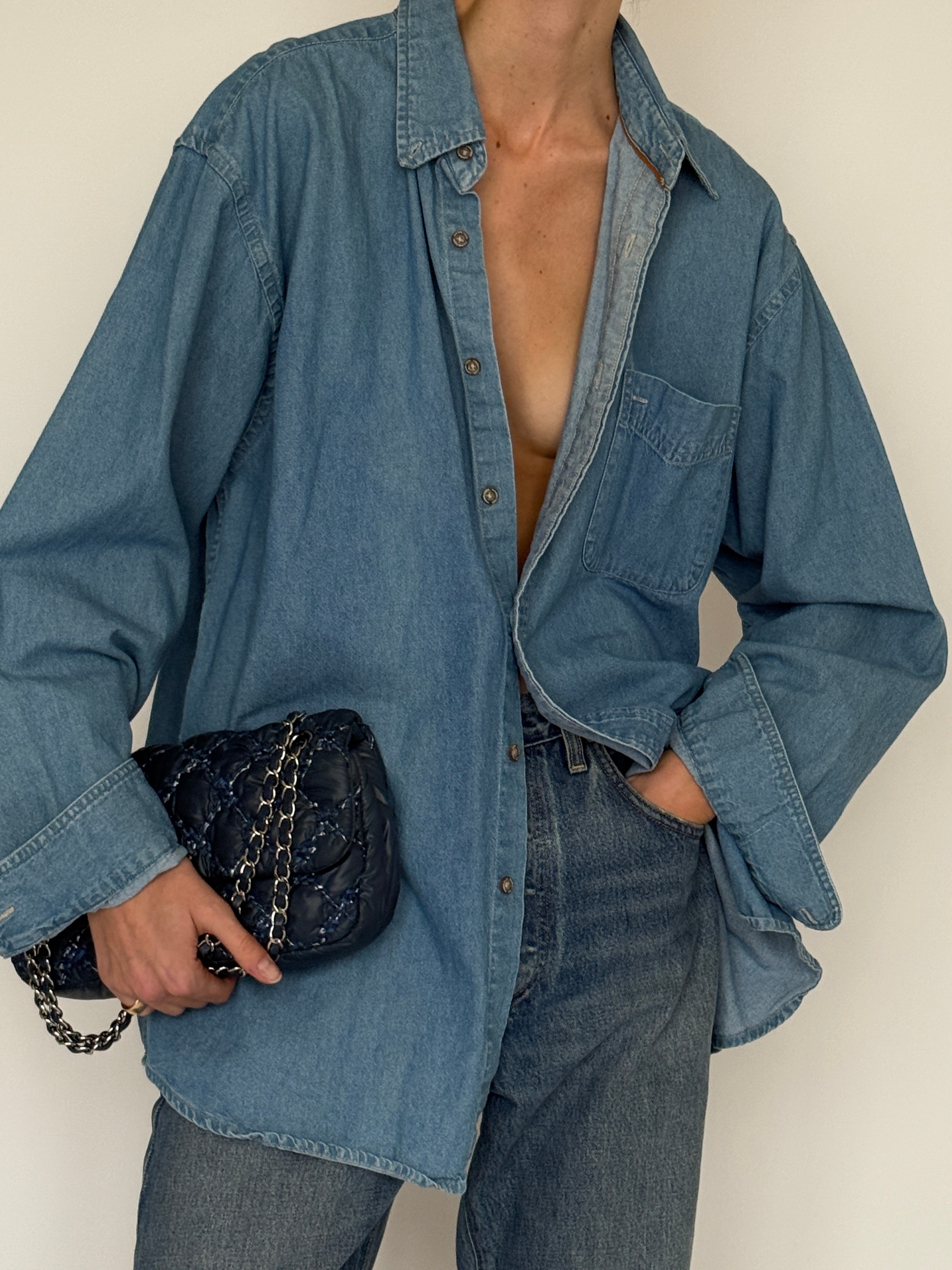 Vintage blue denim shirt fabric close-up