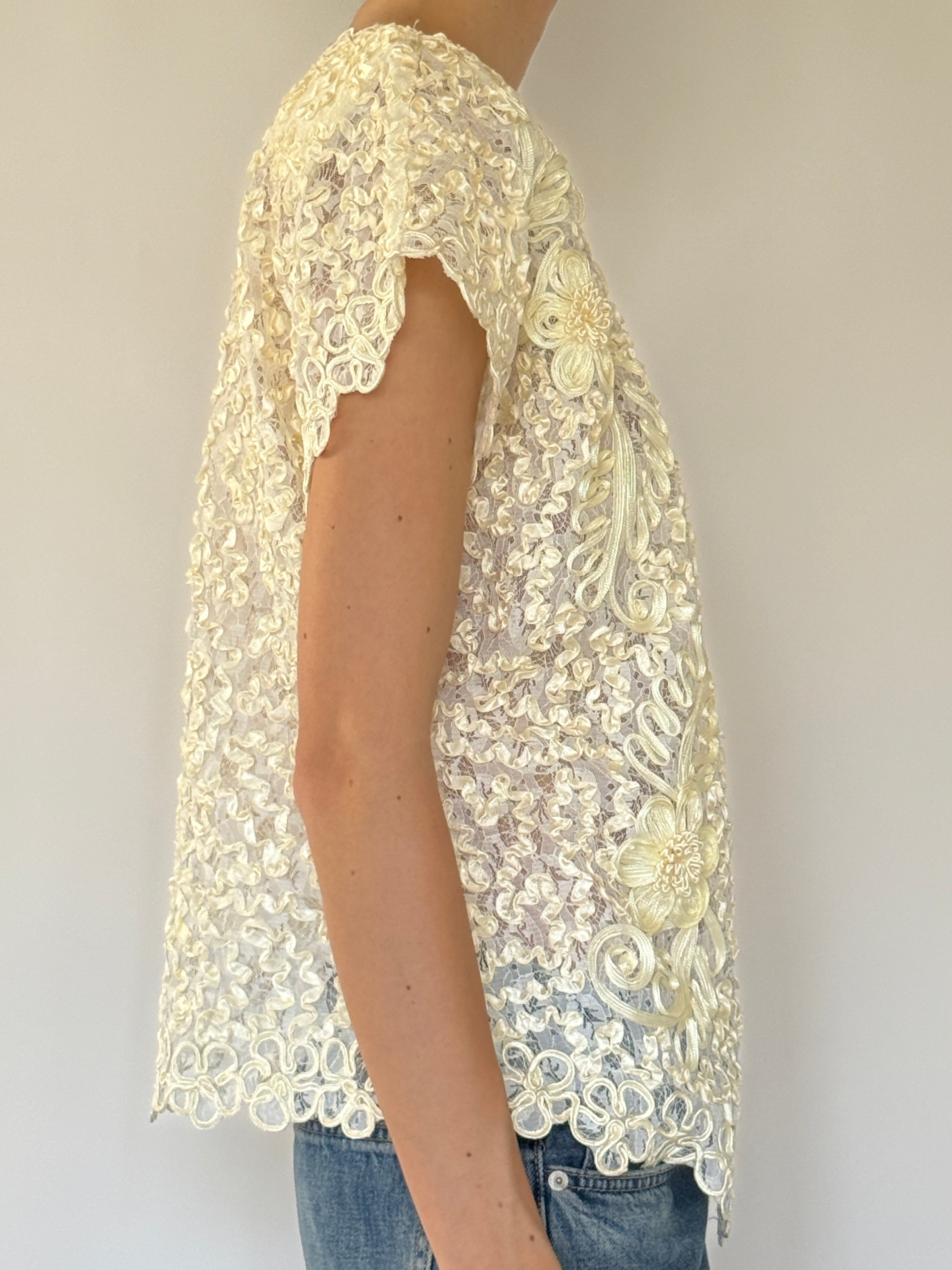 Vintage cream lace floral top side view with textured floral embroidery