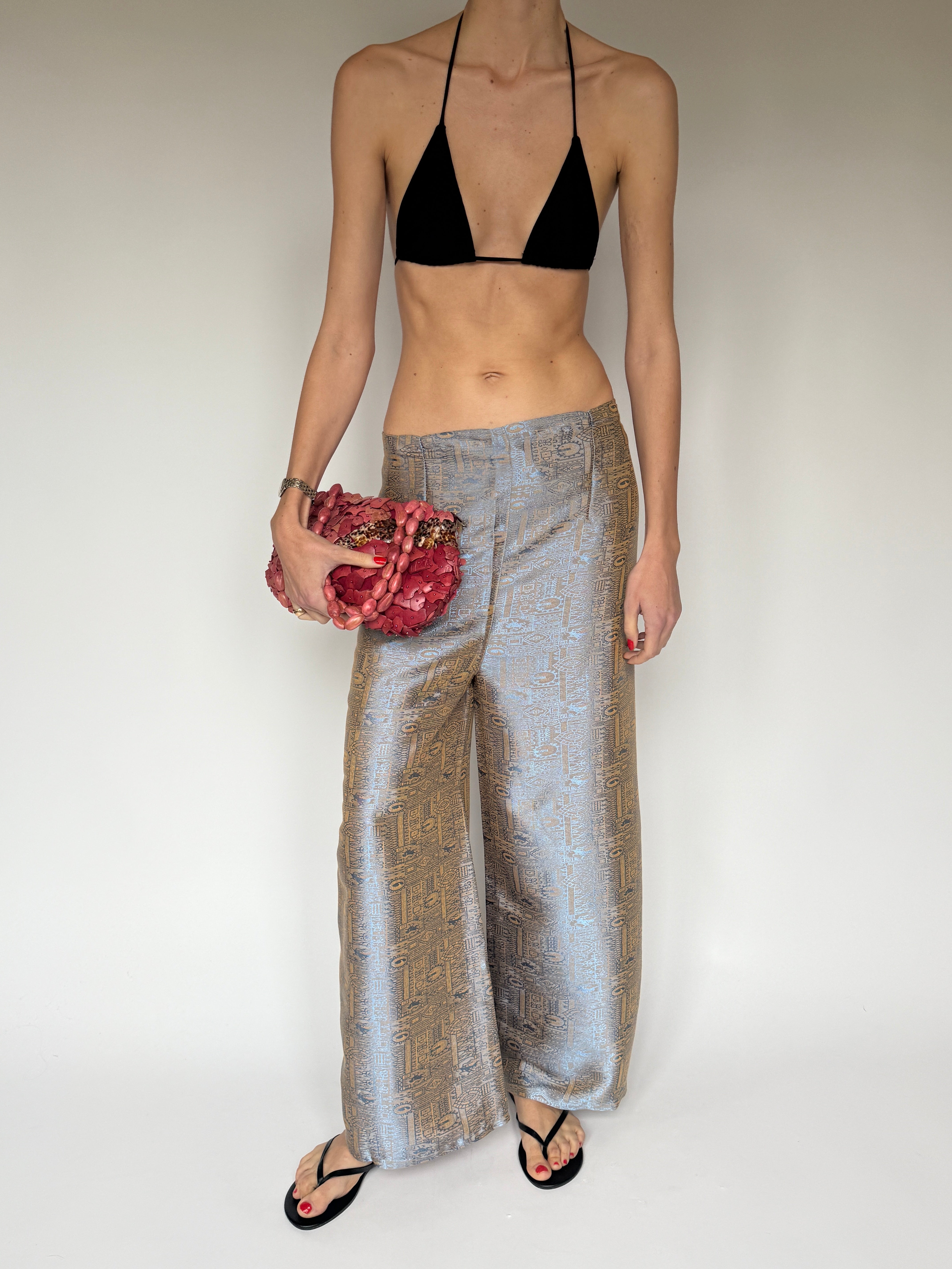 Vintage patterned pants featuring a soft light blue and tan woven design full body