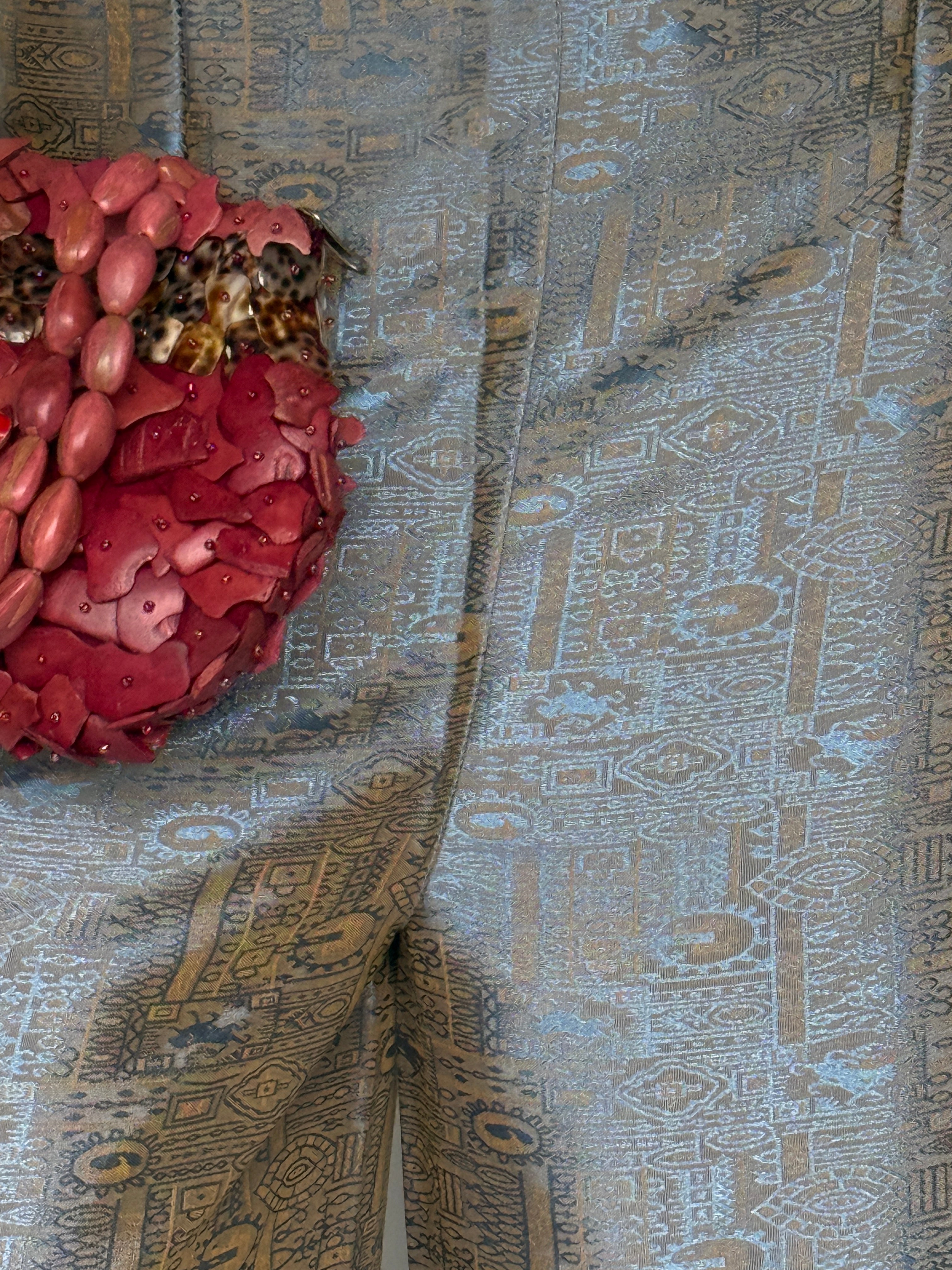 Vintage patterned pants featuring a soft light blue and tan woven design detail