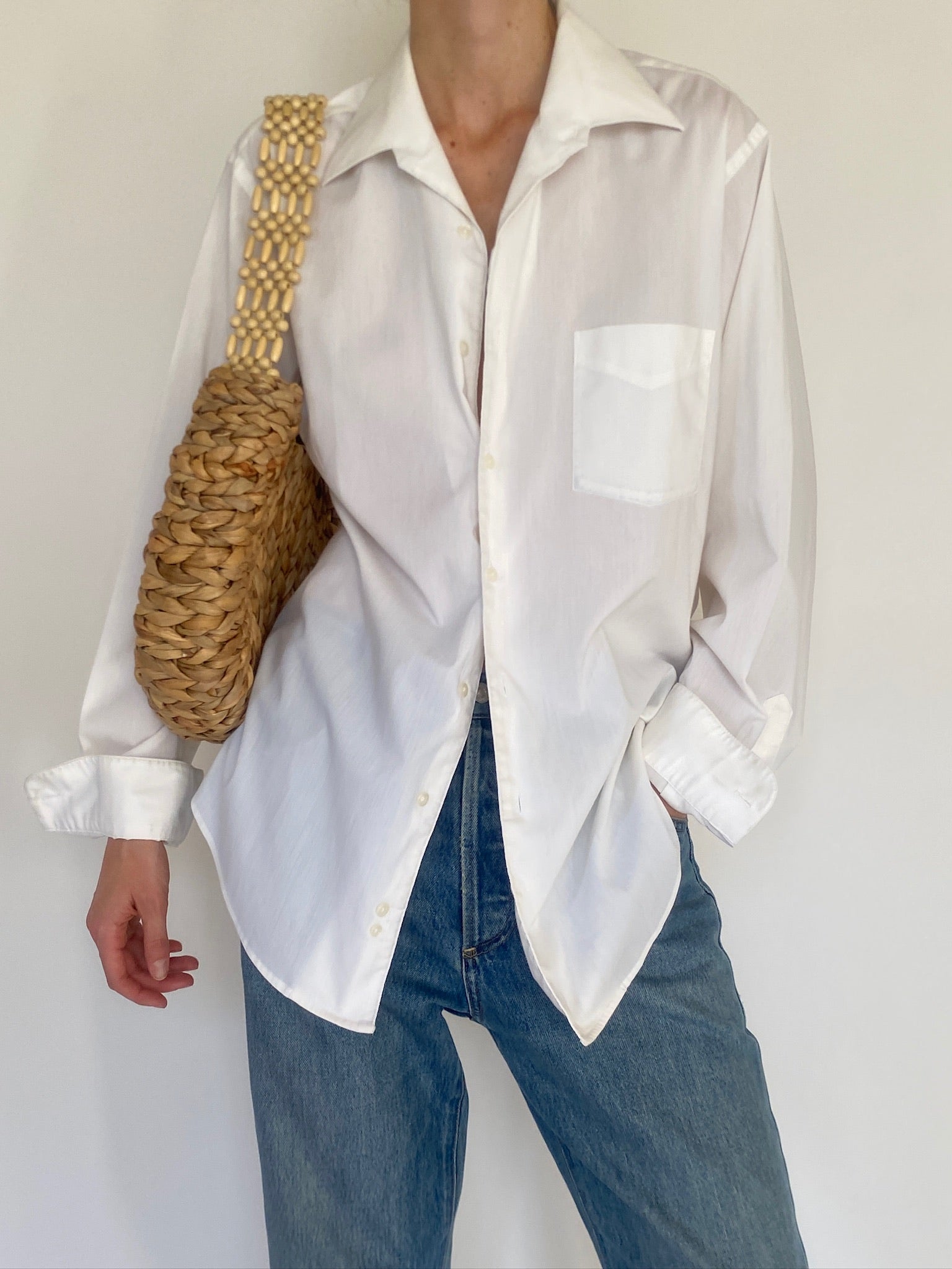 Vintage white button-up shirt button detail close-up