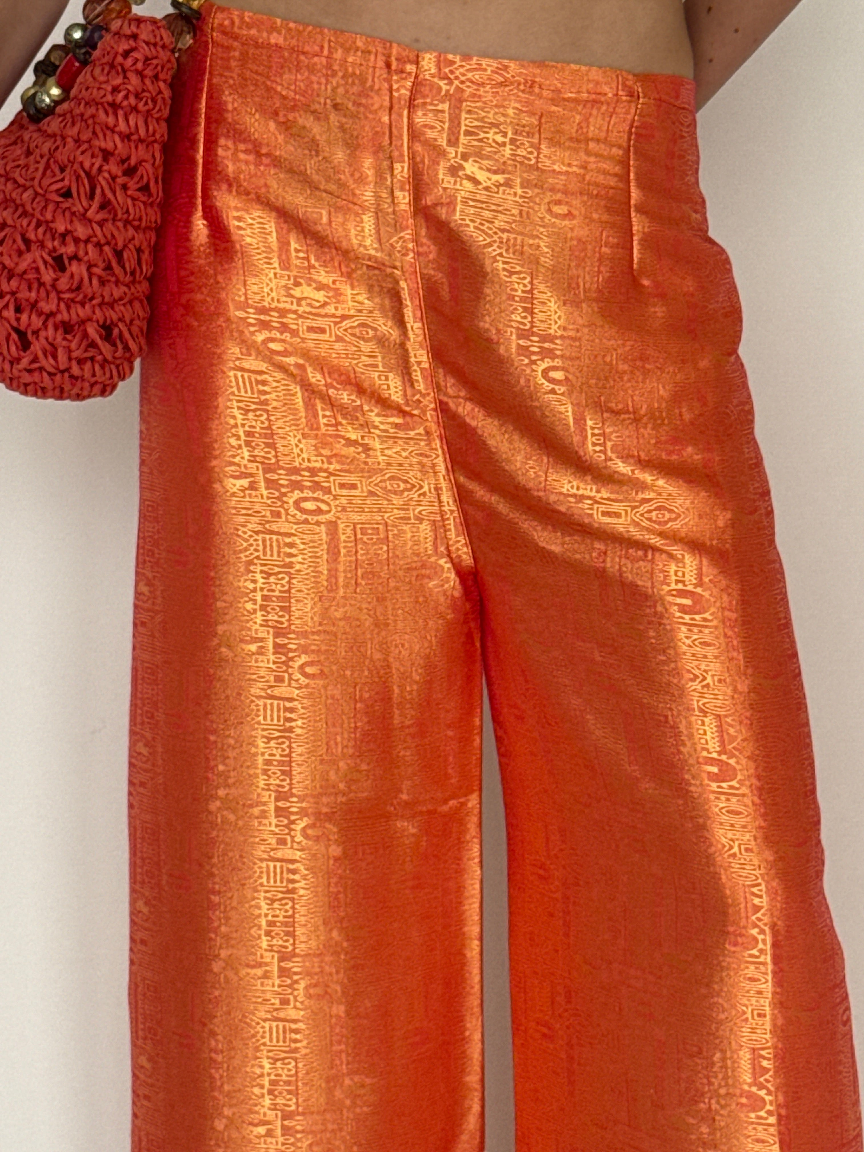 Vintage orange jacquard wide-leg trousers fabric sheen detail