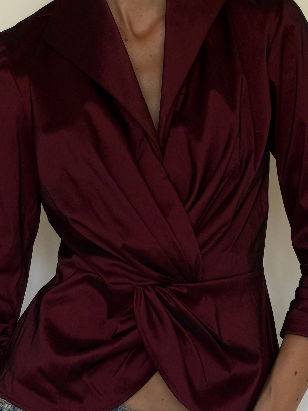 Vintage burgundy blouse fabric close-up showing lustrous finish