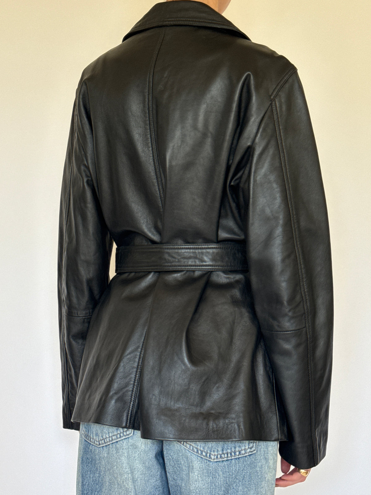 Vintage black leather jacket back view