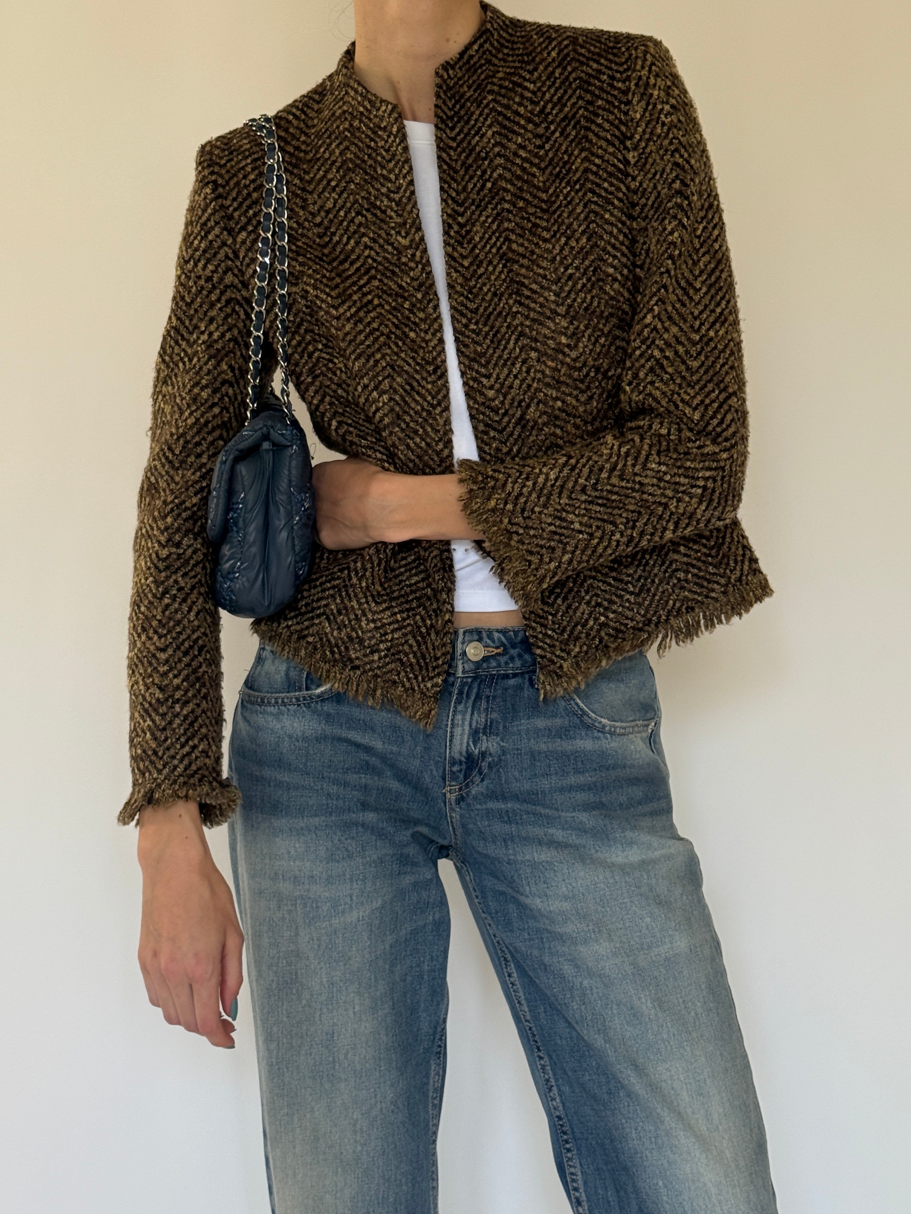 Vintage brown herringbone jacket close-up detail