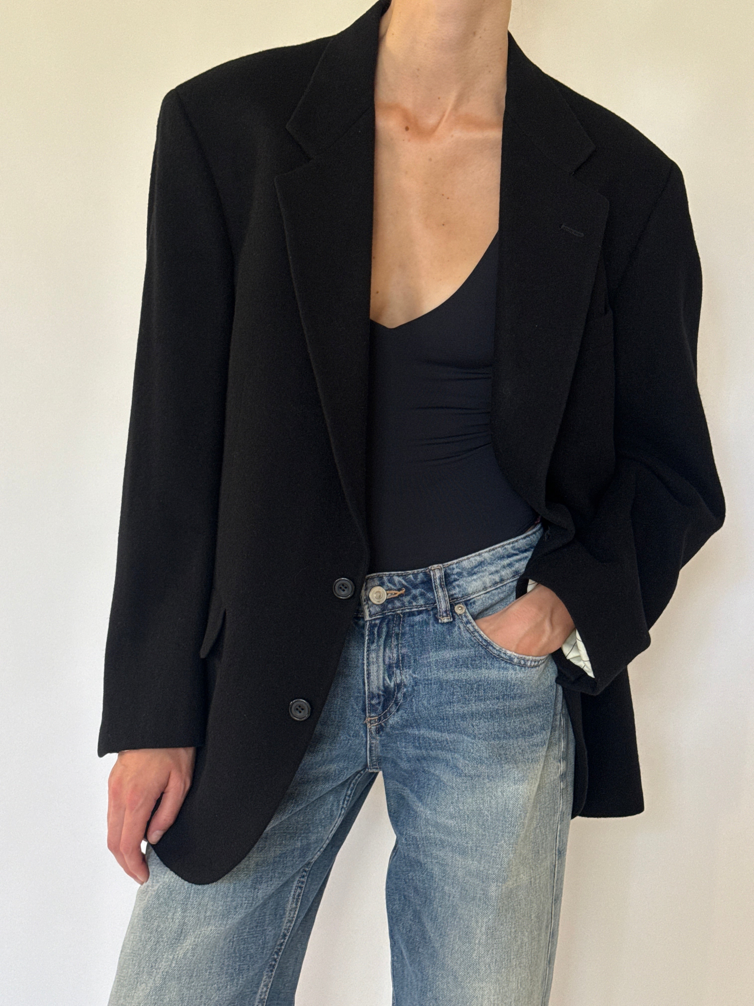 Vintage black blazer lapel detail close-up