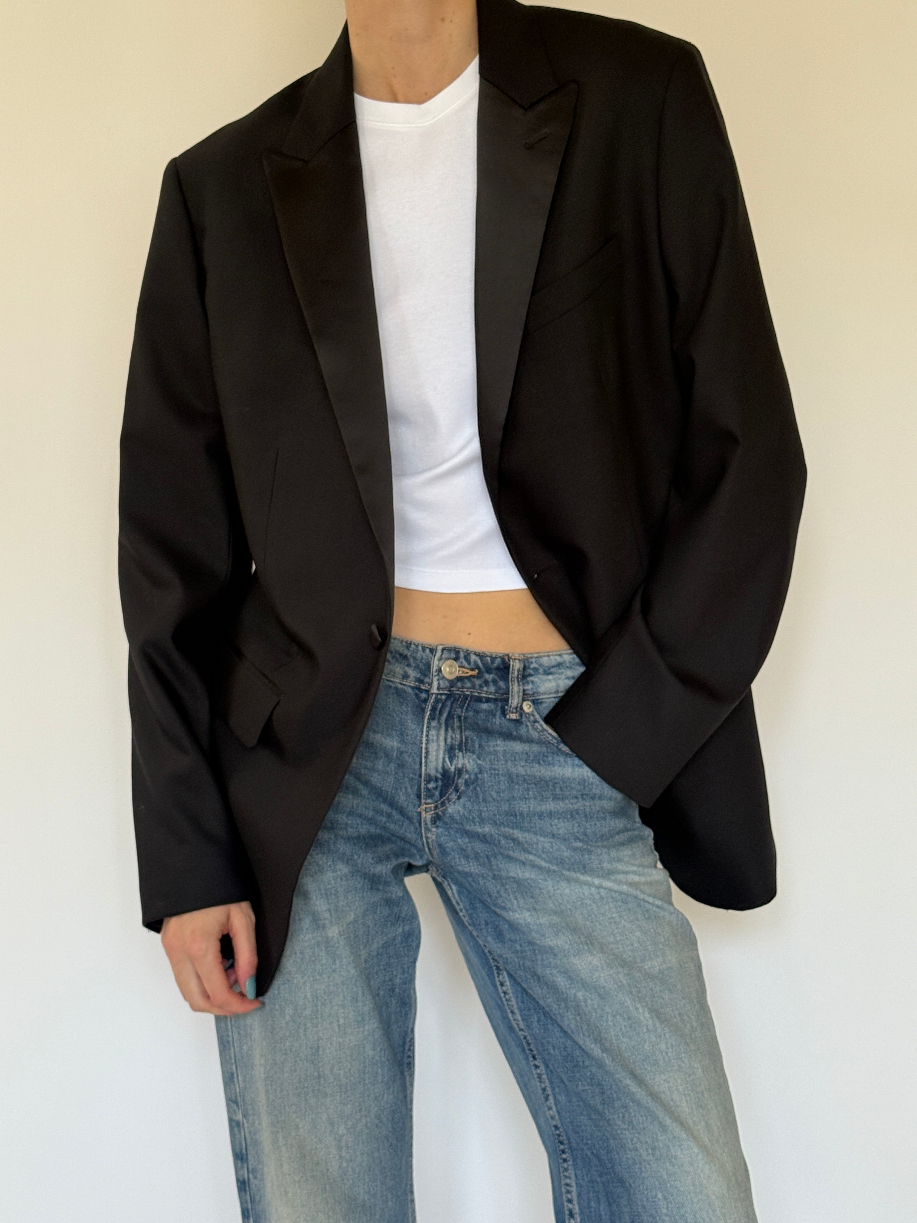 Vintage black wool blazer fabric close-up