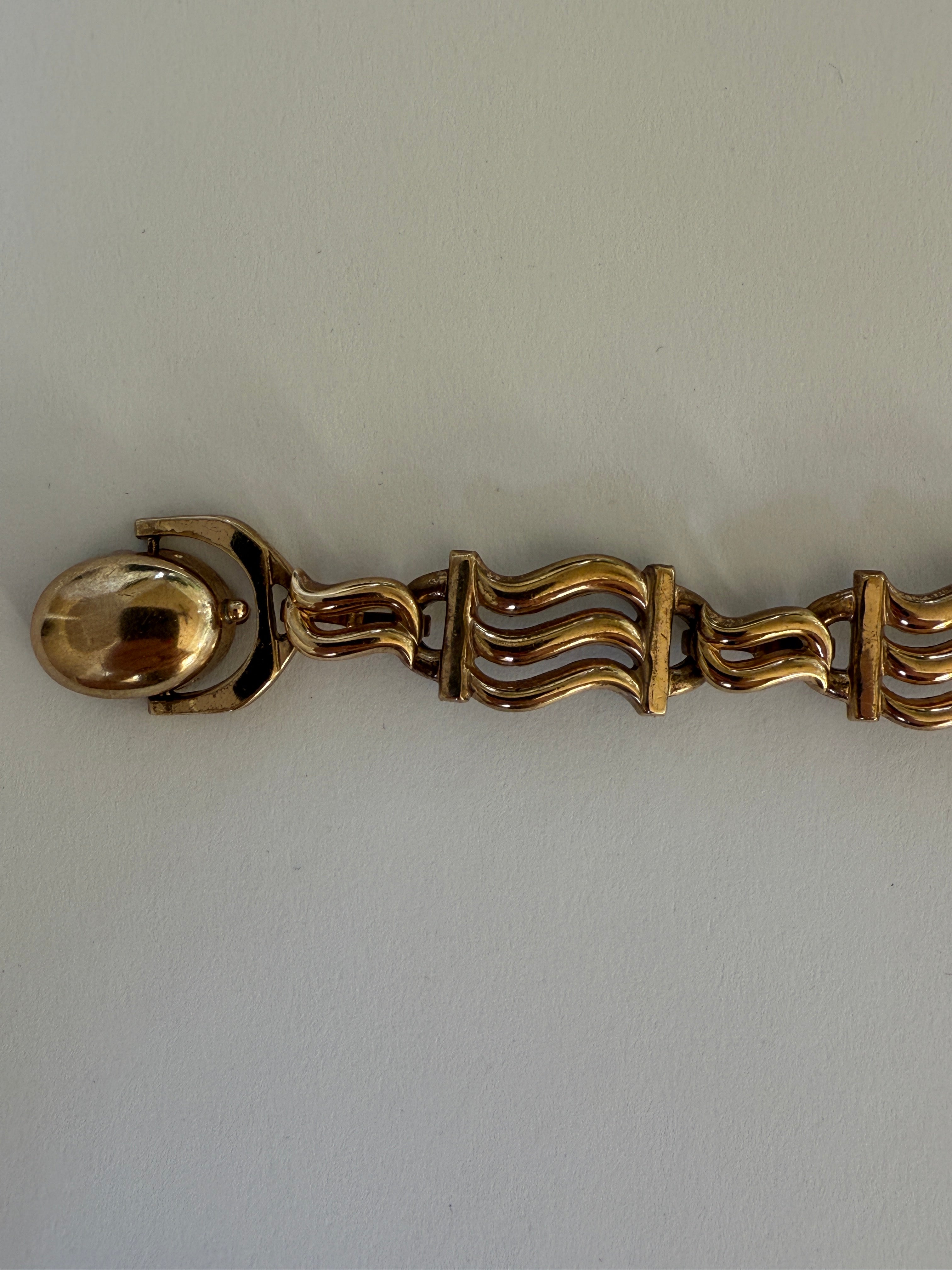 Vintage gold-tone bracelet link detail close-up