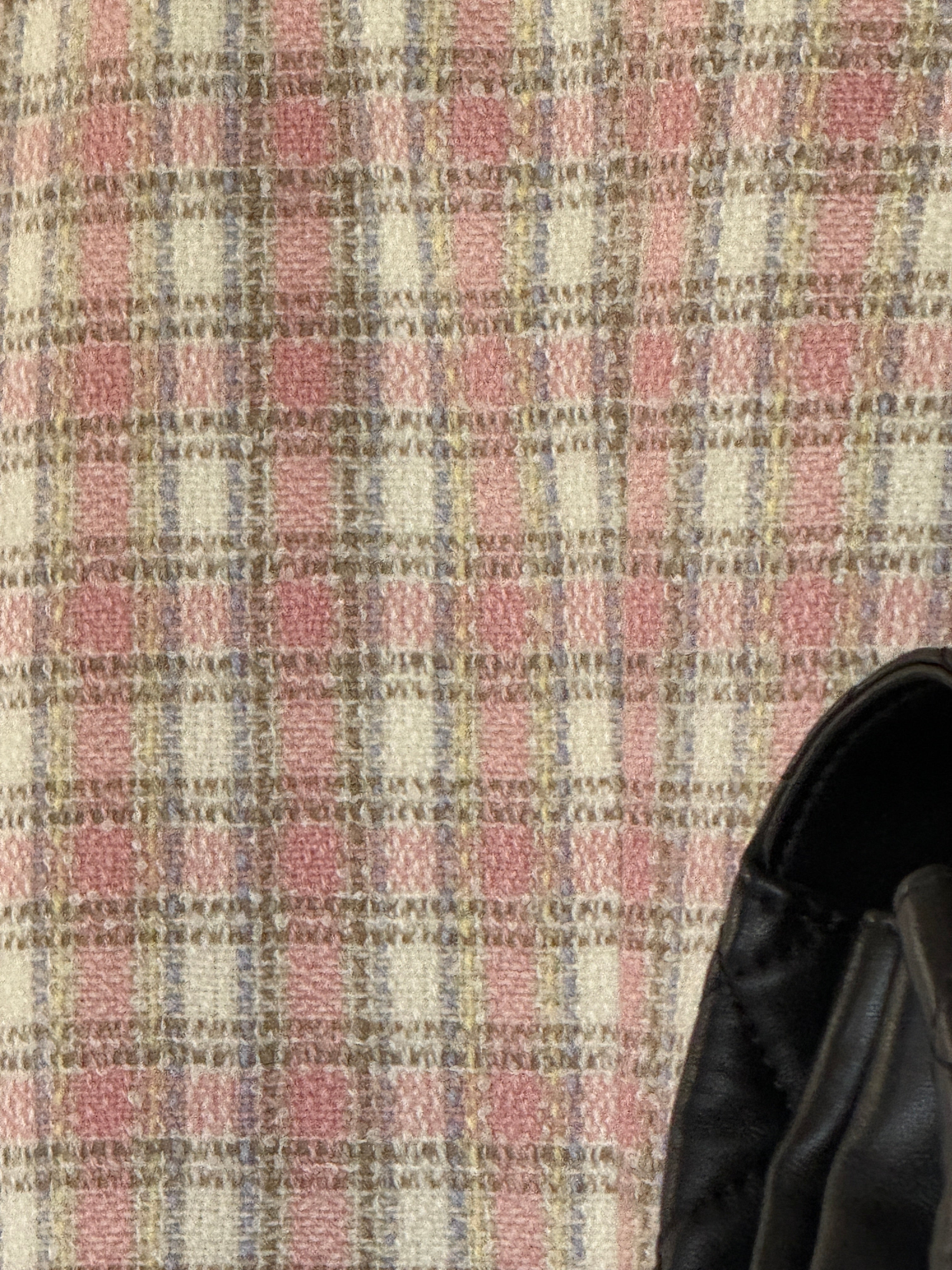 Vintage pink and cream tweed fabric close-up
