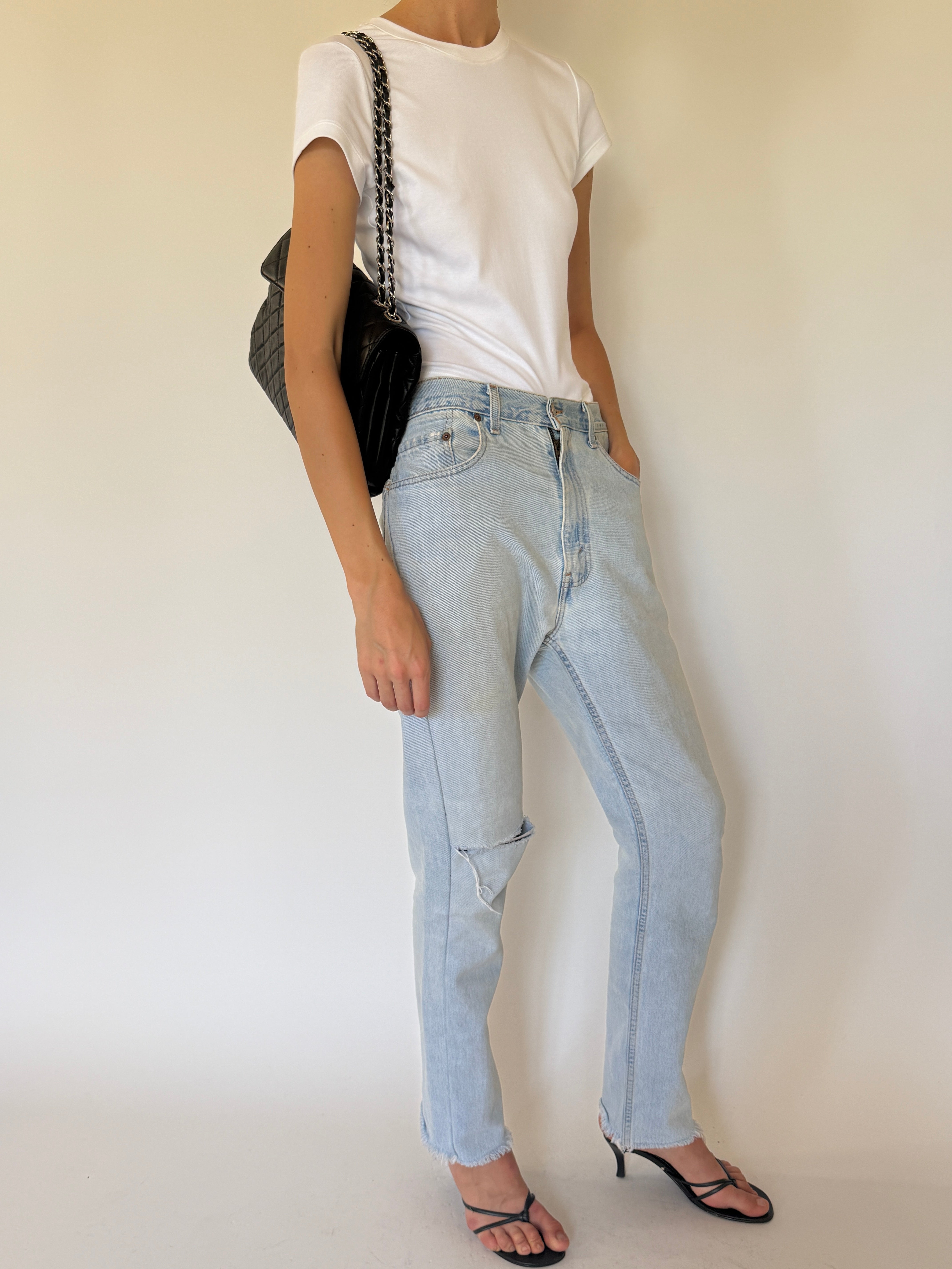 Vintage Levi's 550 light wash jeans side view