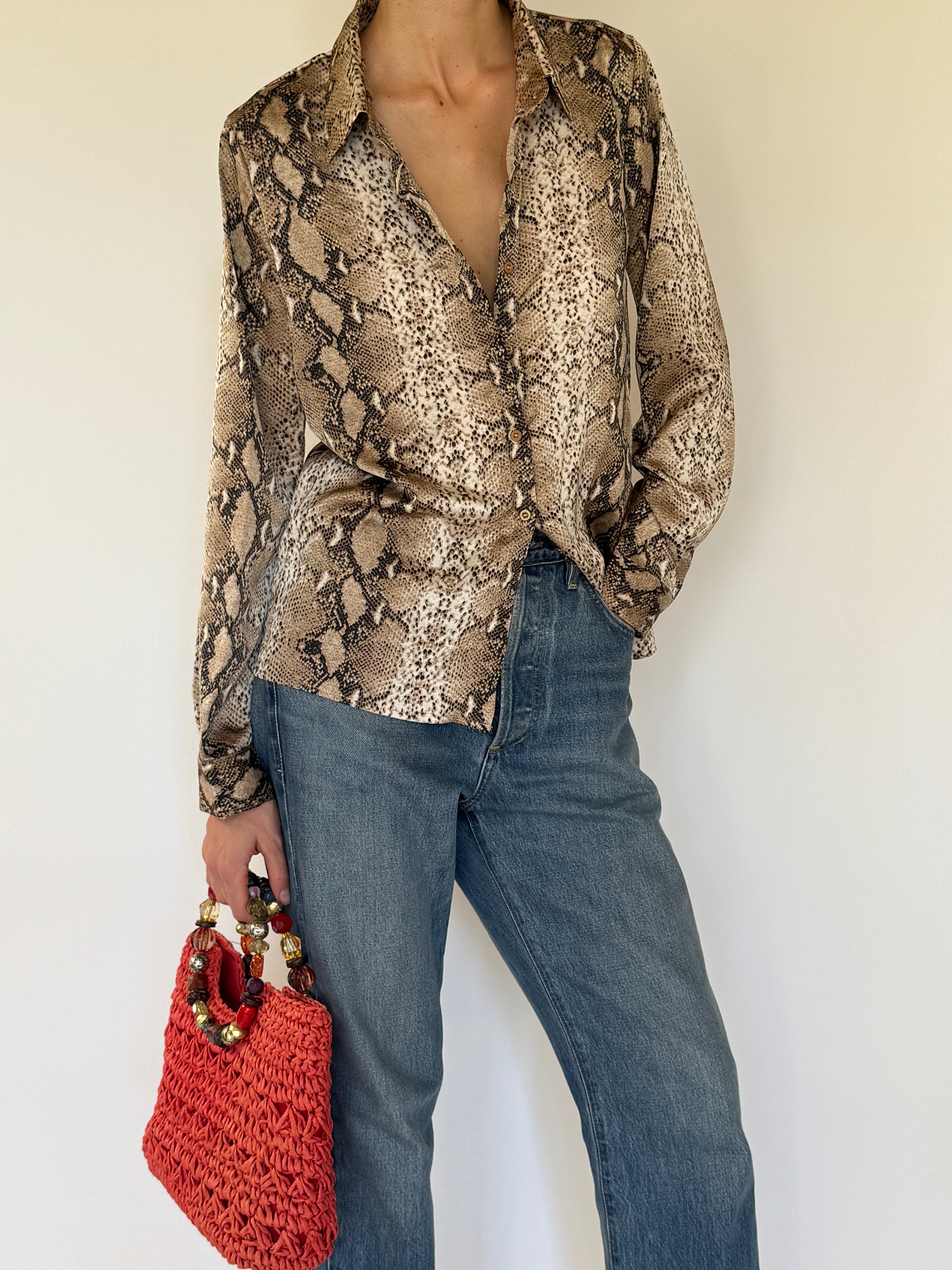 Vintage snake print button-up shirt button detail