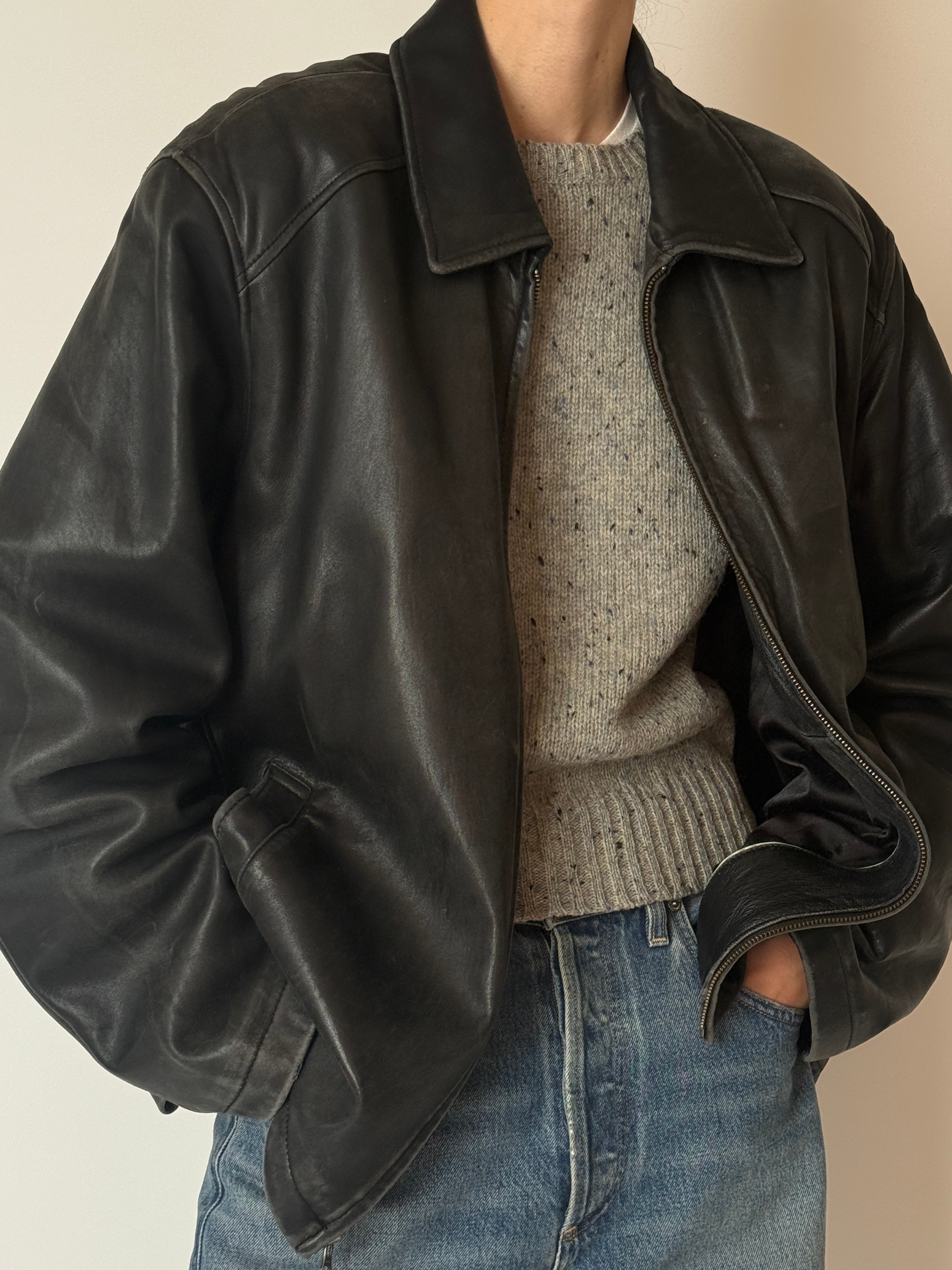 Vintage black leather jacket with lived-in patina