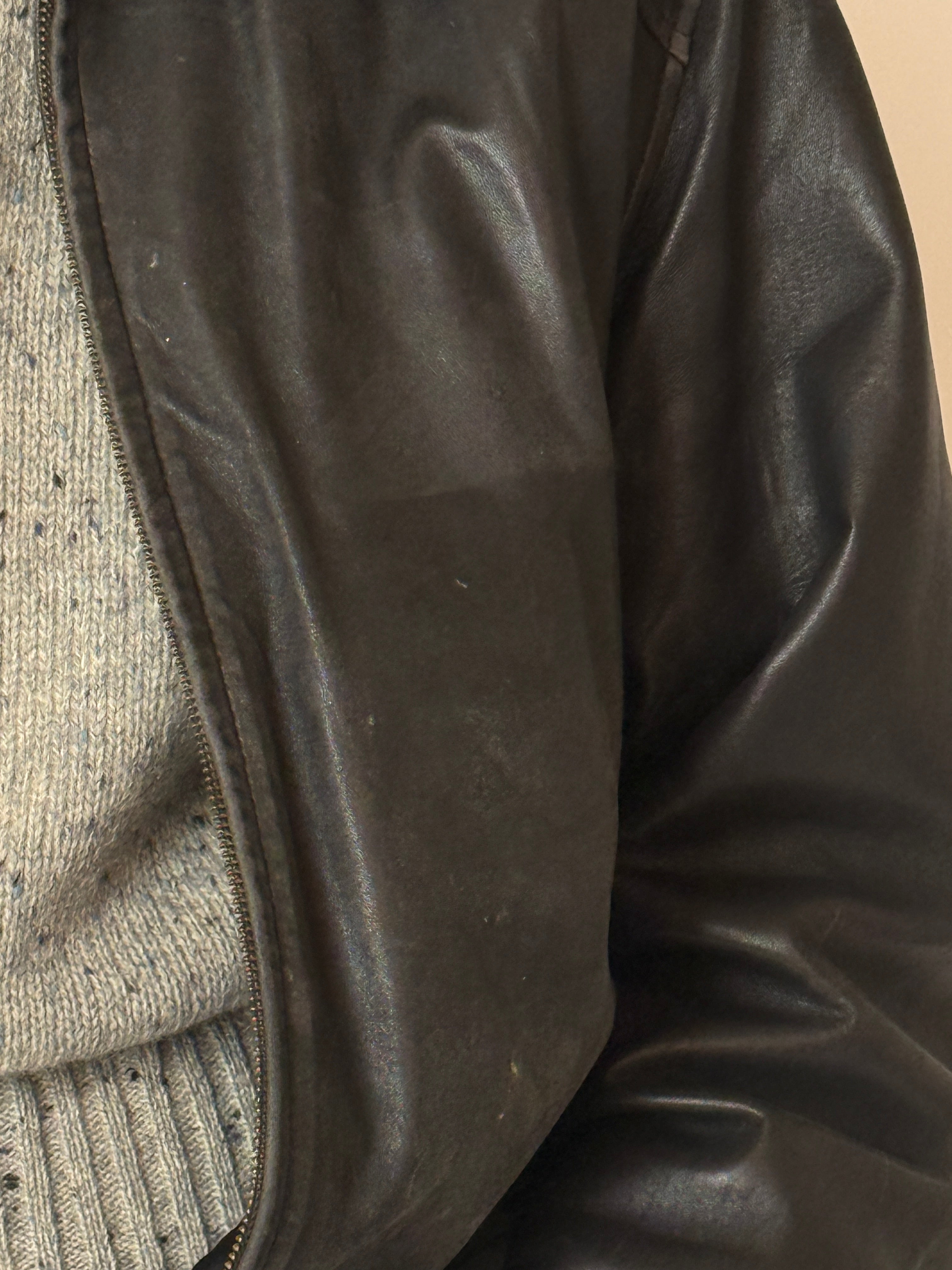 Vintage black leather jacket with lived-in patina