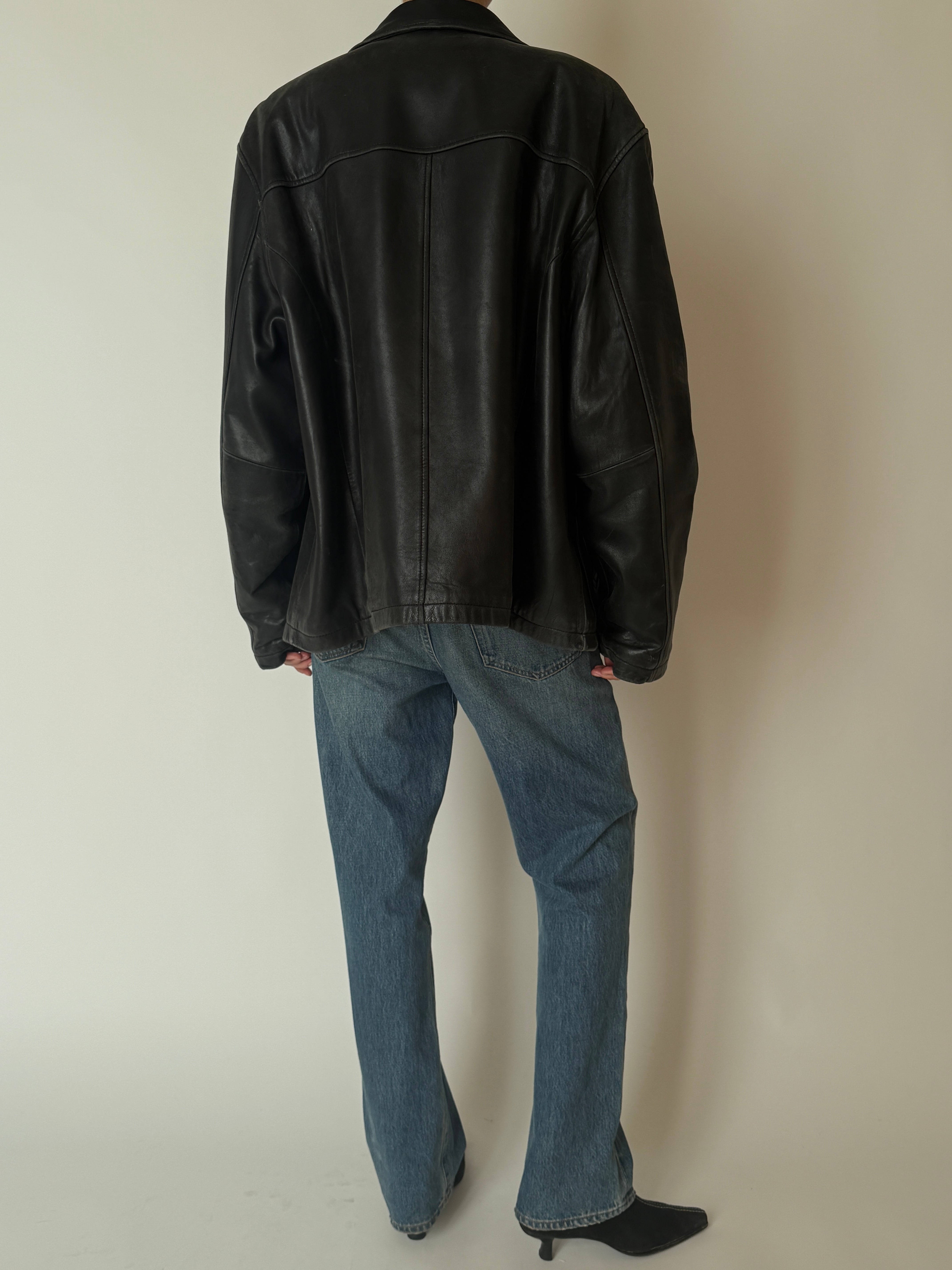 Vintage leather jacket with relaxed fit and natural wear back

