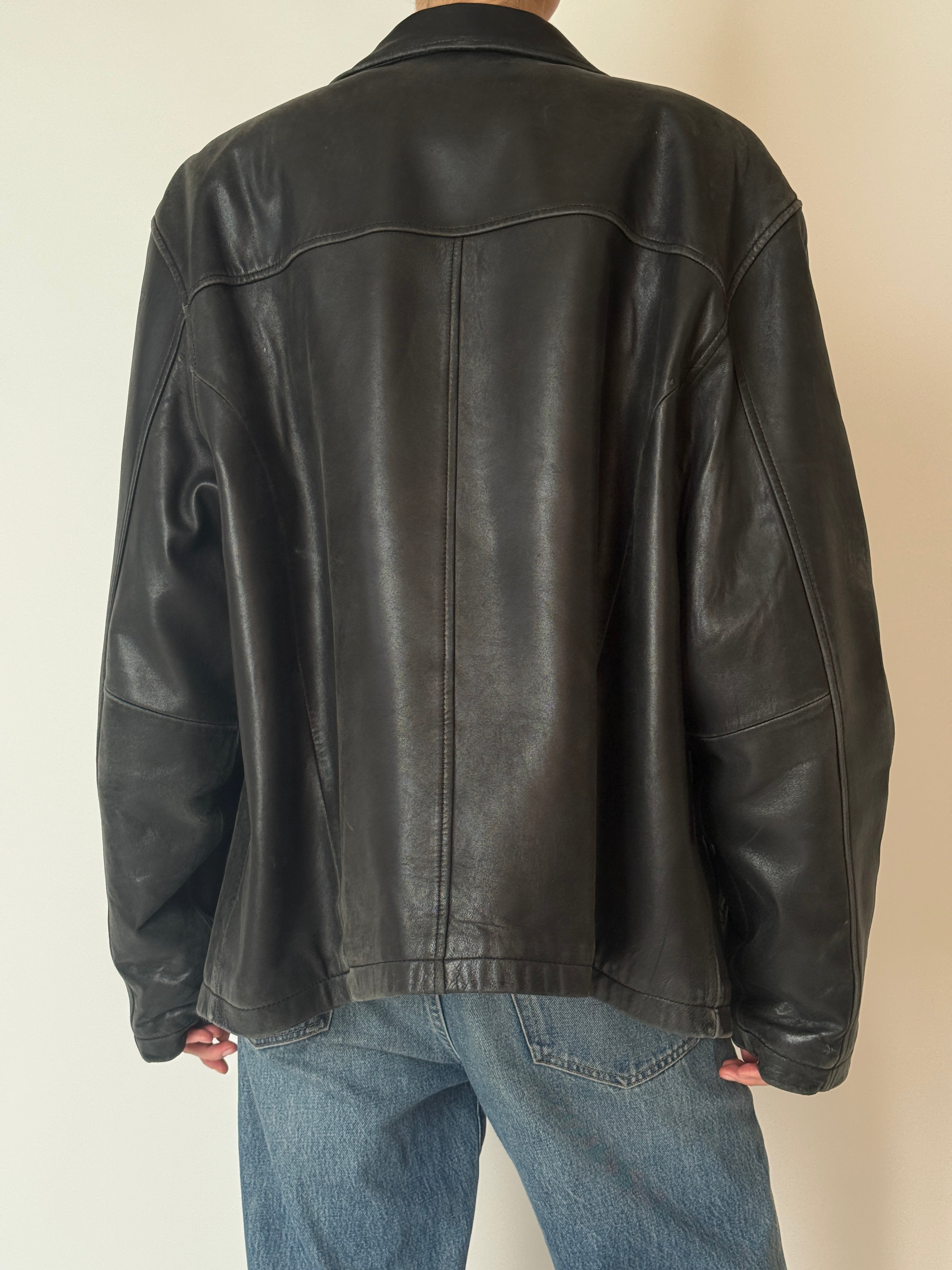 Vintage leather jacket with relaxed fit and natural wear back detail