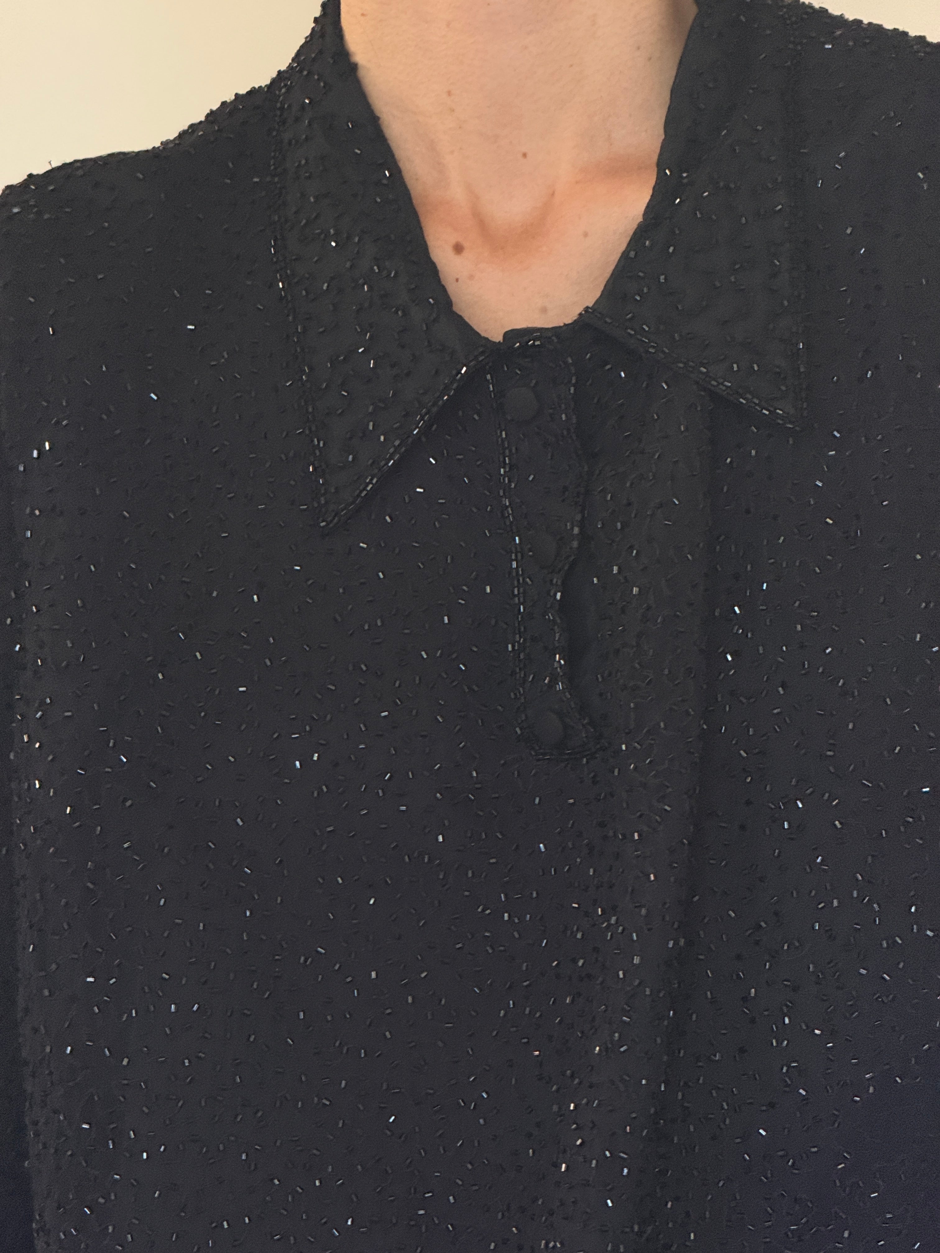 Vintage black silk beaded fabric close-up