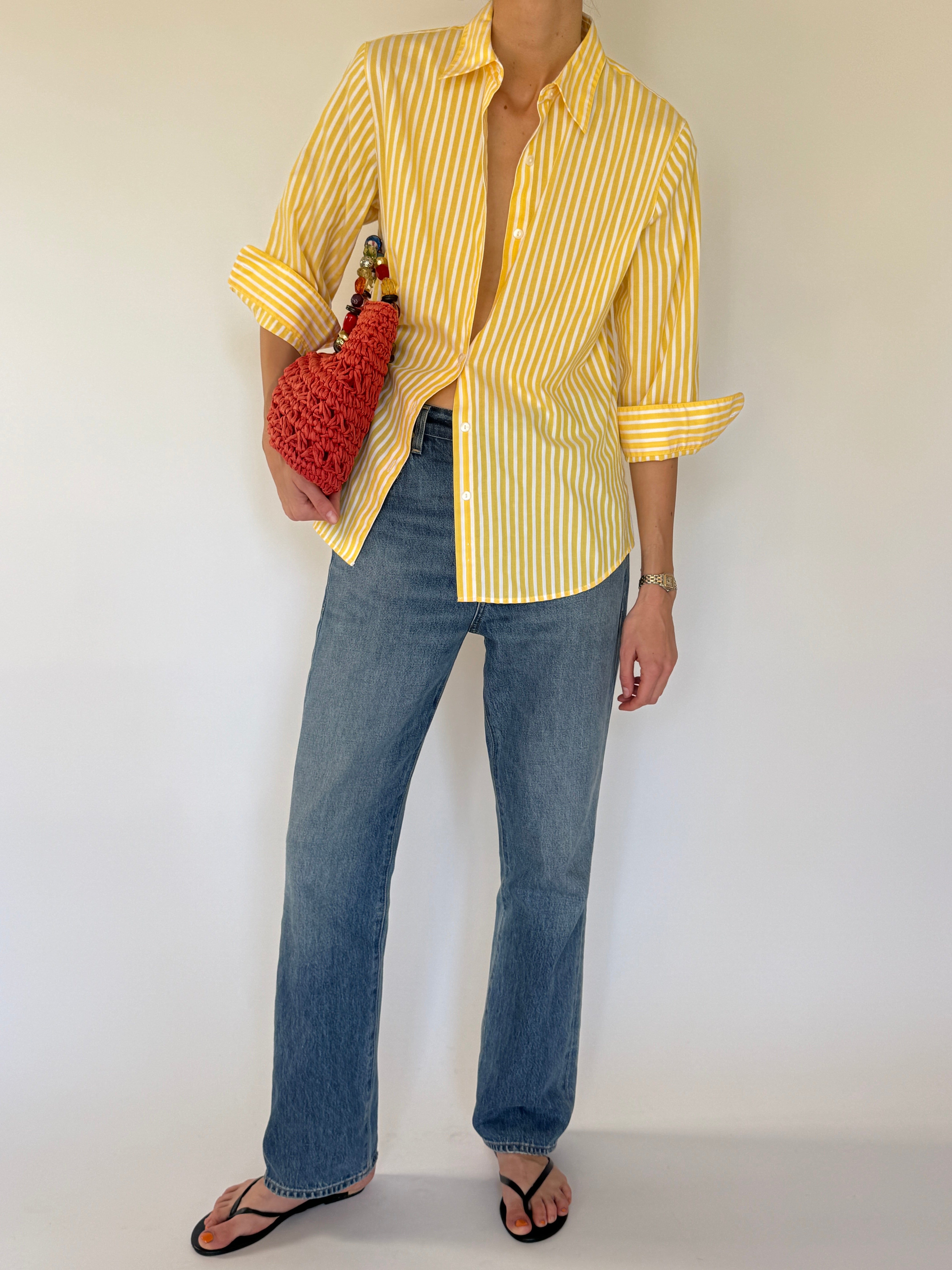 Vintage yellow striped shirt button detail