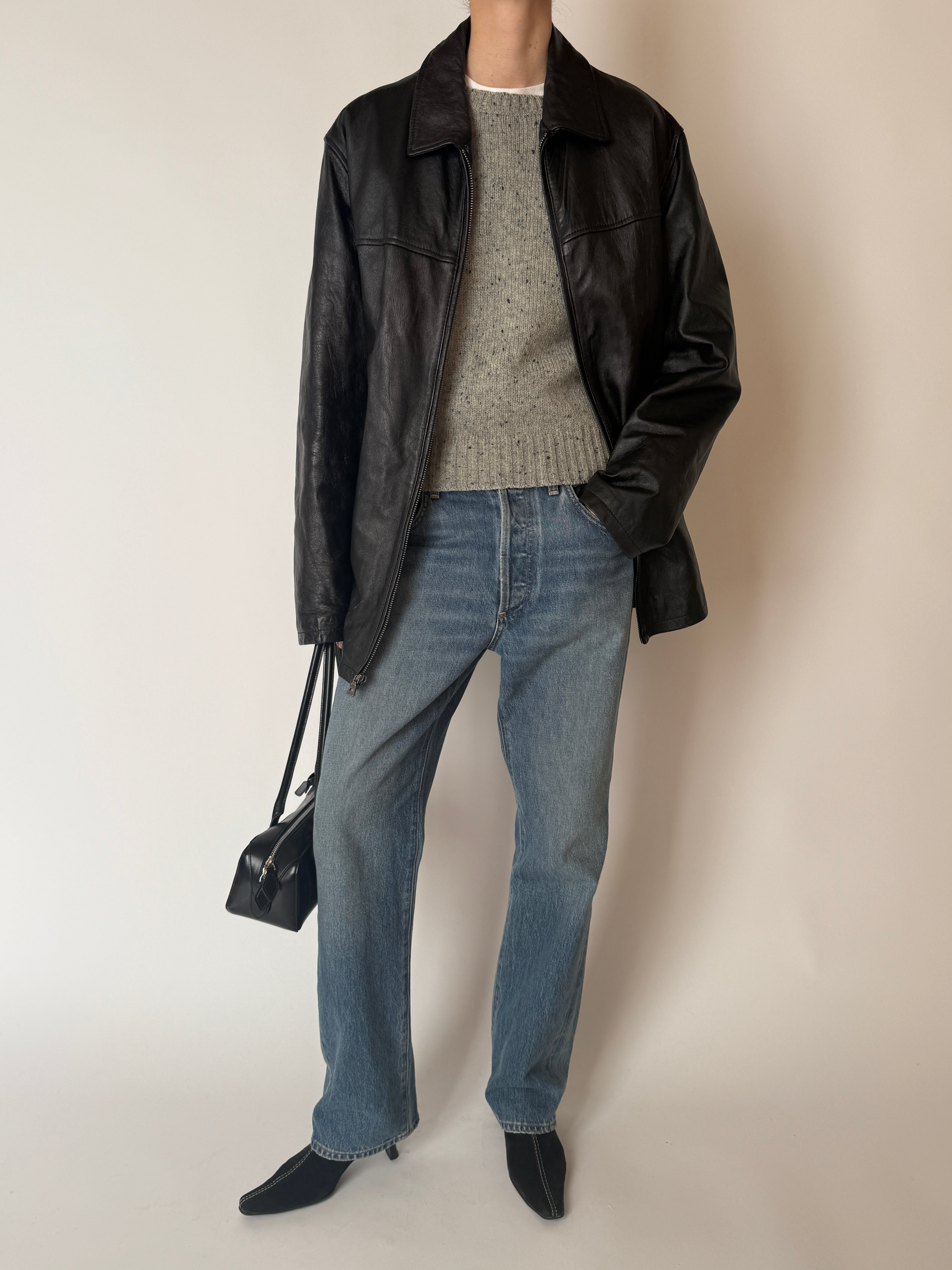 Vintage black zip-front leather jacket, front view