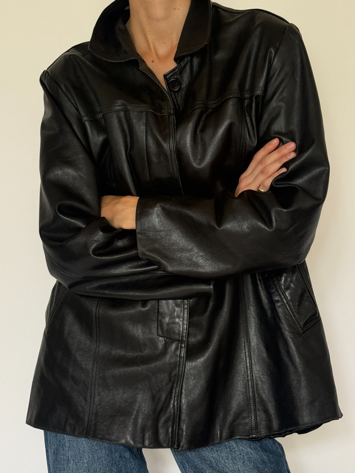 Vintage black leather jacket front detail view