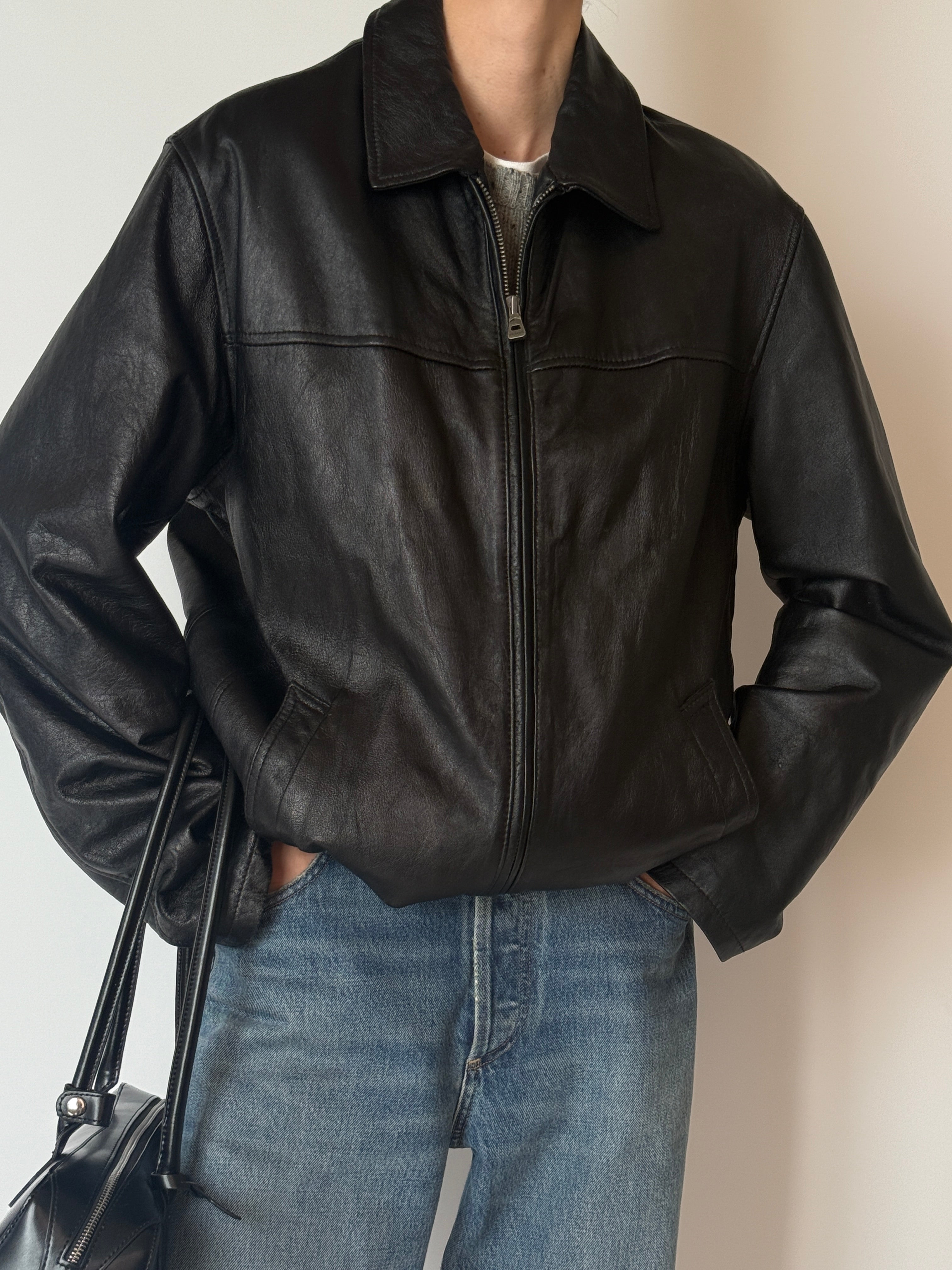 Vintage black zip-front leather jacket, front view