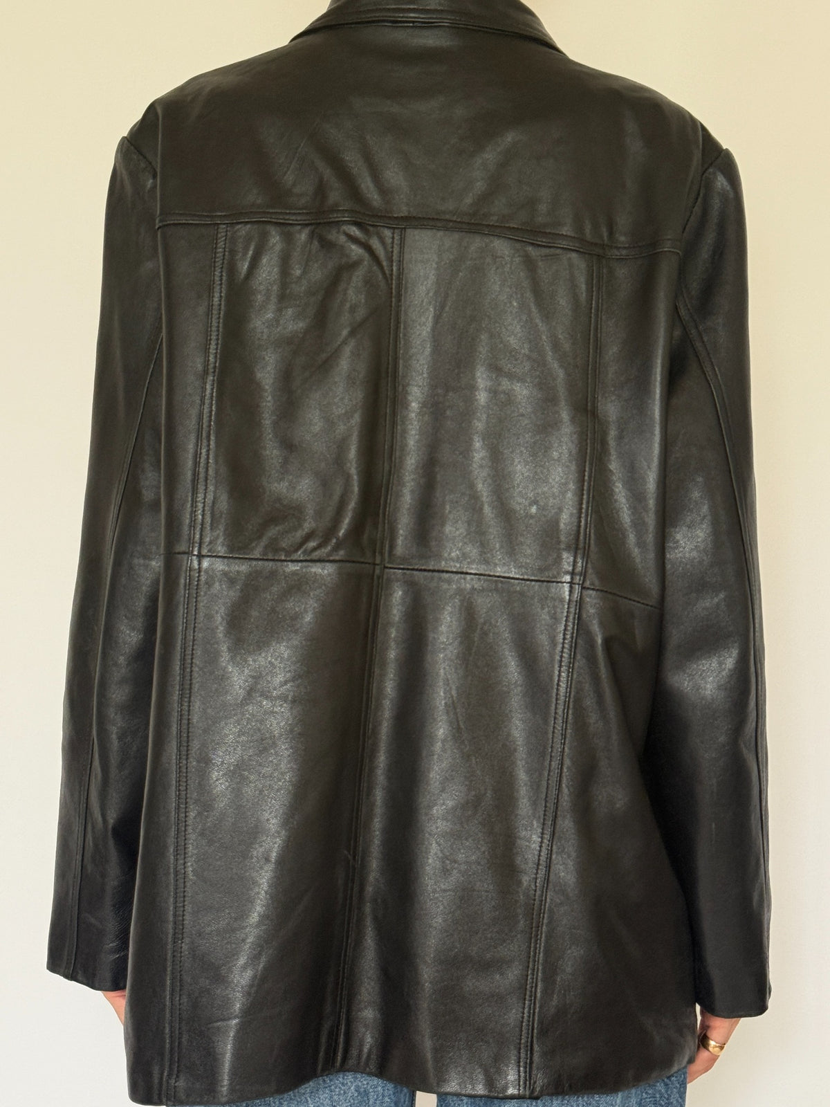 Vintage black leather jacket back view