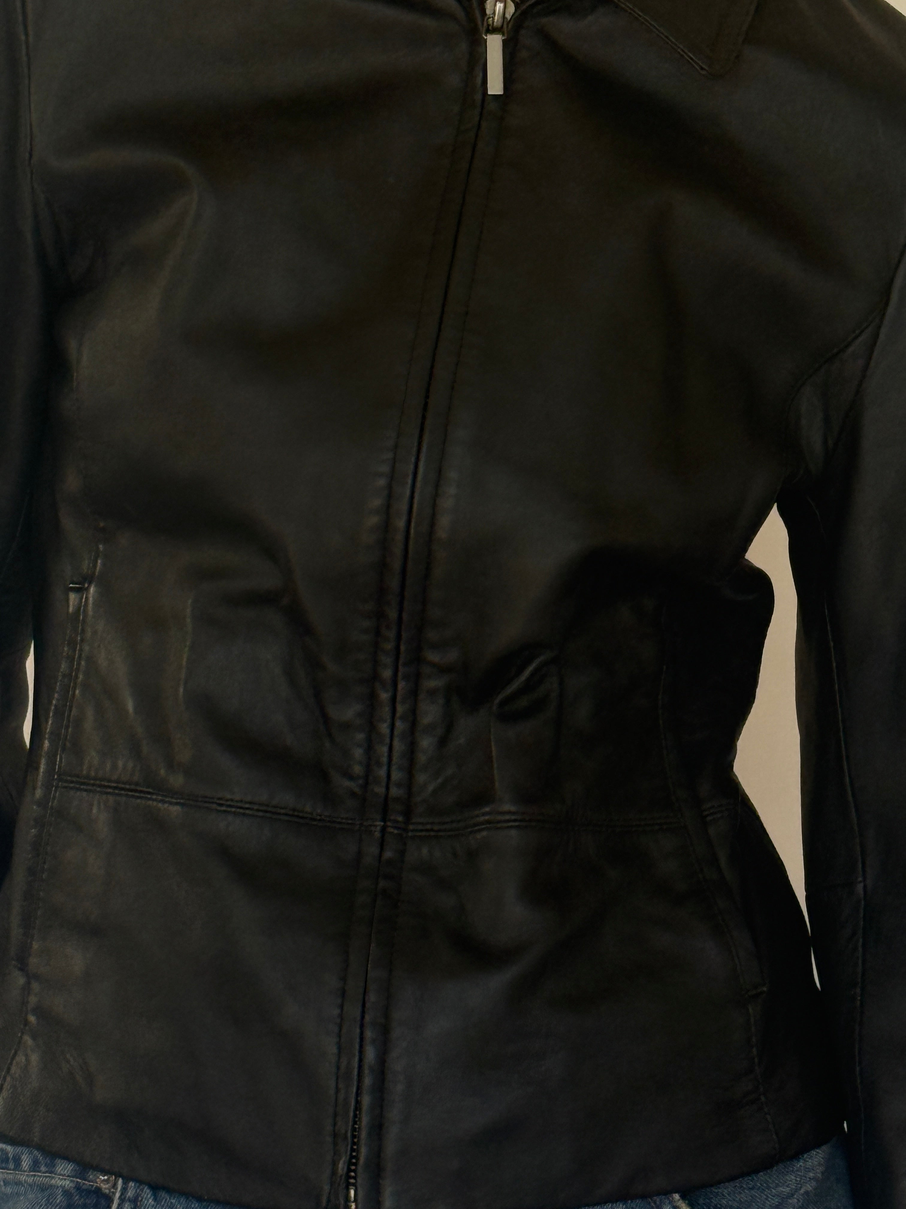 Vintage black leather jacket leather texture close-up