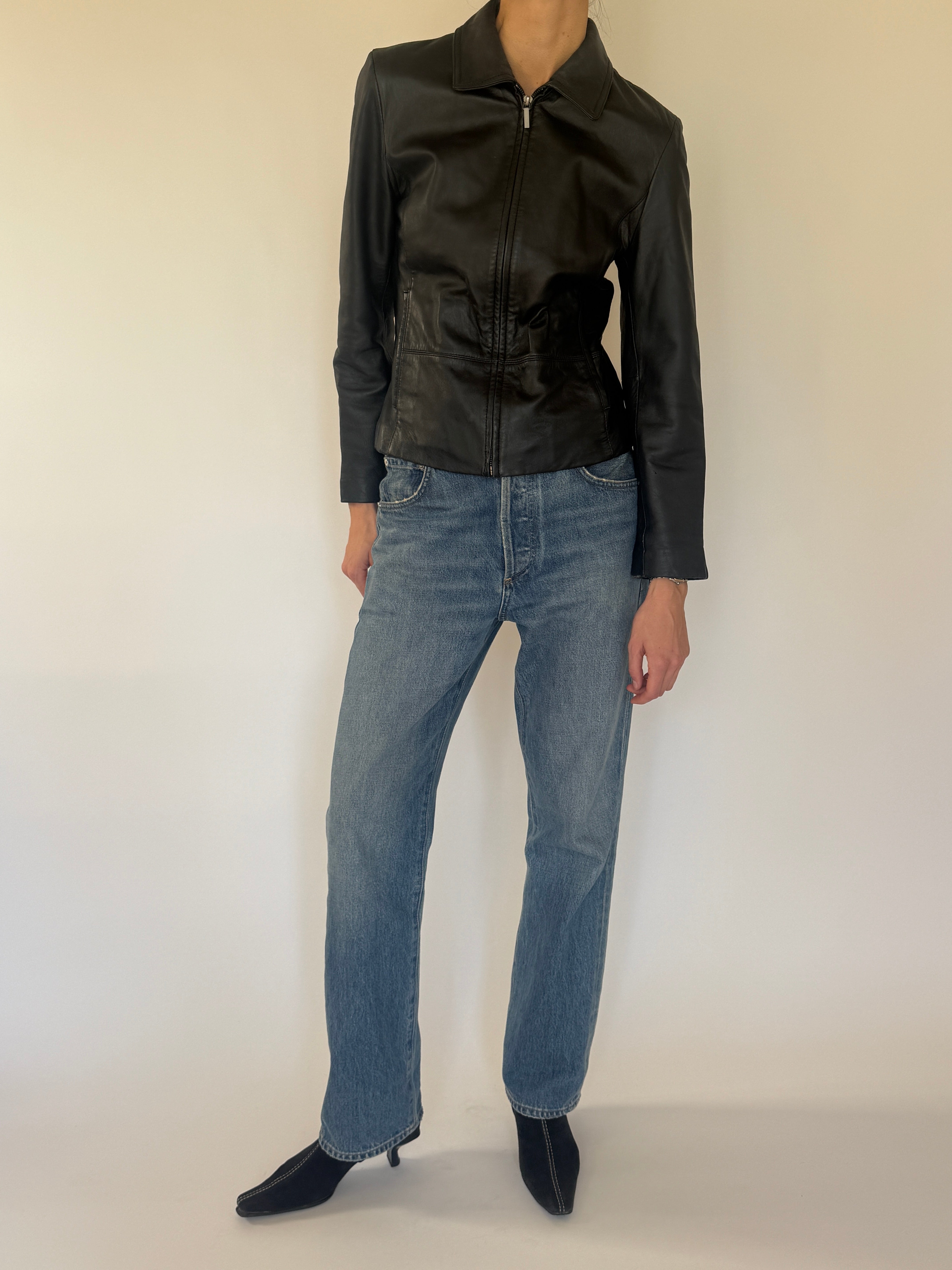 Vintage black leather jacket zipper detail