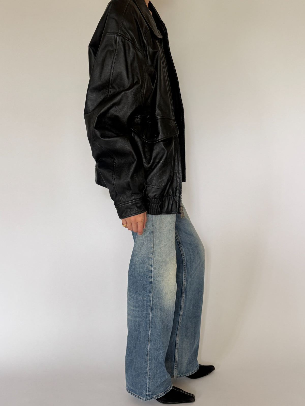 Vintage oversized leather bomber jacket black side view