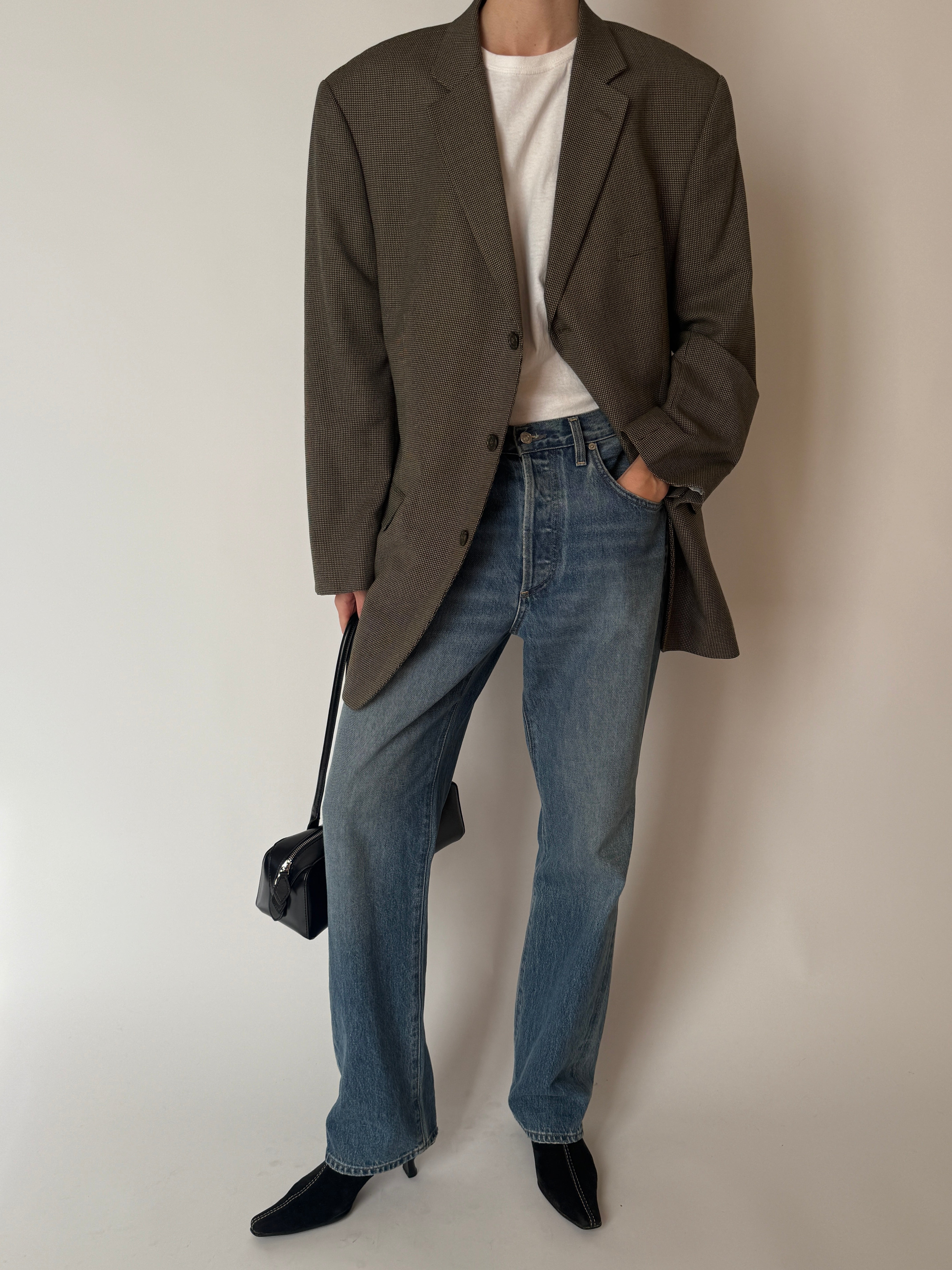 Vintage brown check blazer featuring structured shoulders and flap pockets