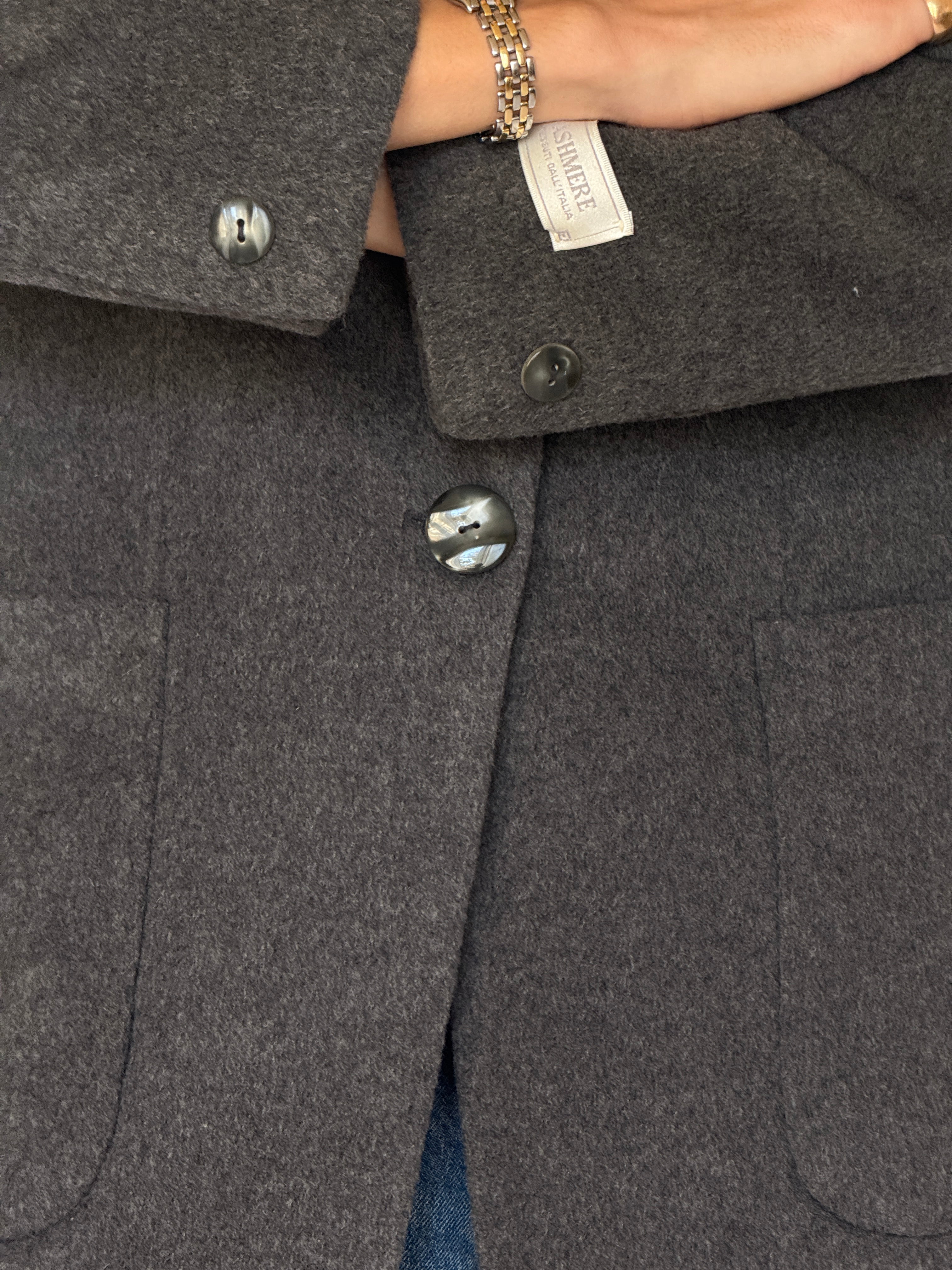 Front view of a vintage charcoal wool blazer 