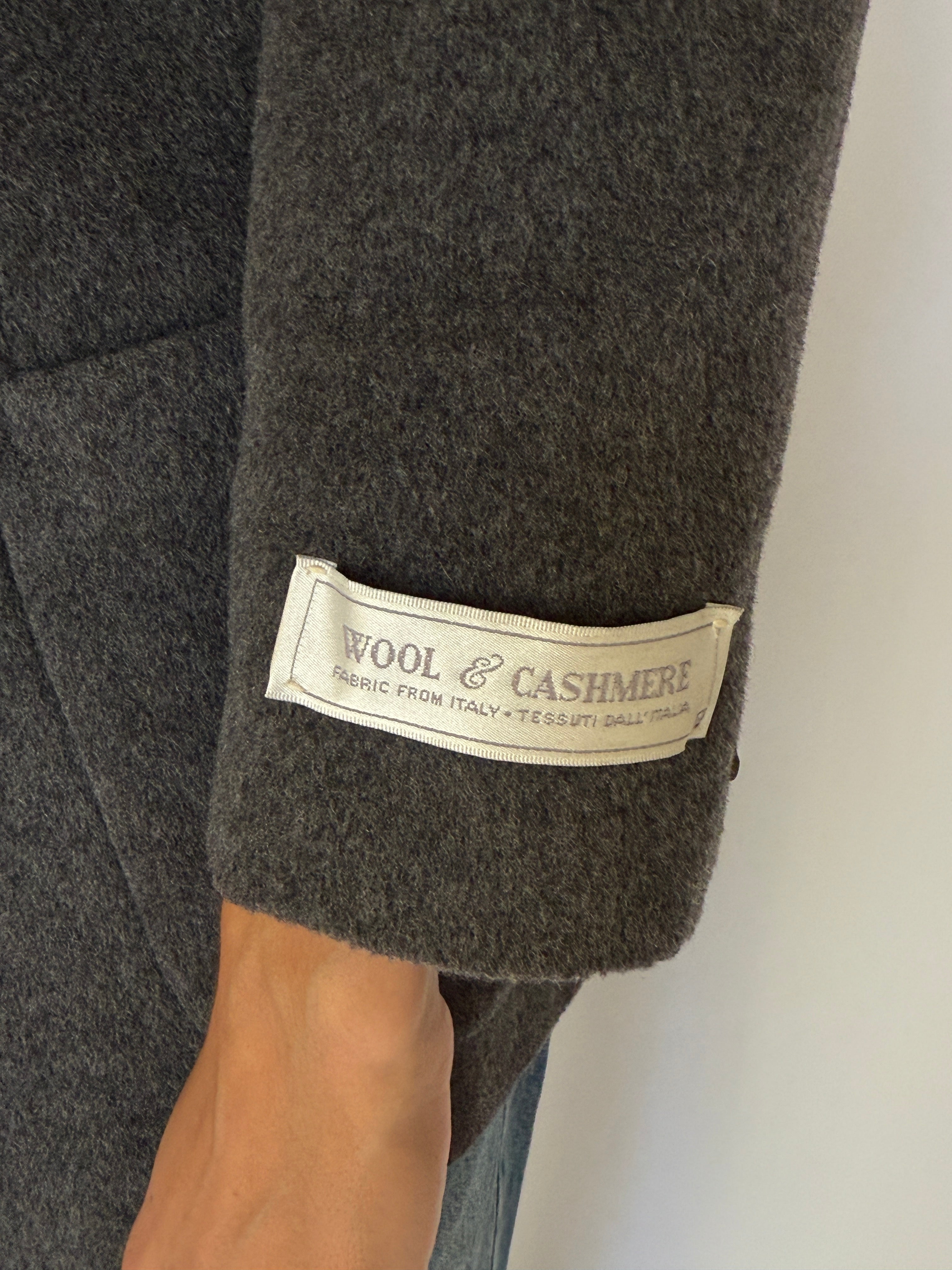 Detail shot of wool and cashmere fabric label on vintage blazer sleeve