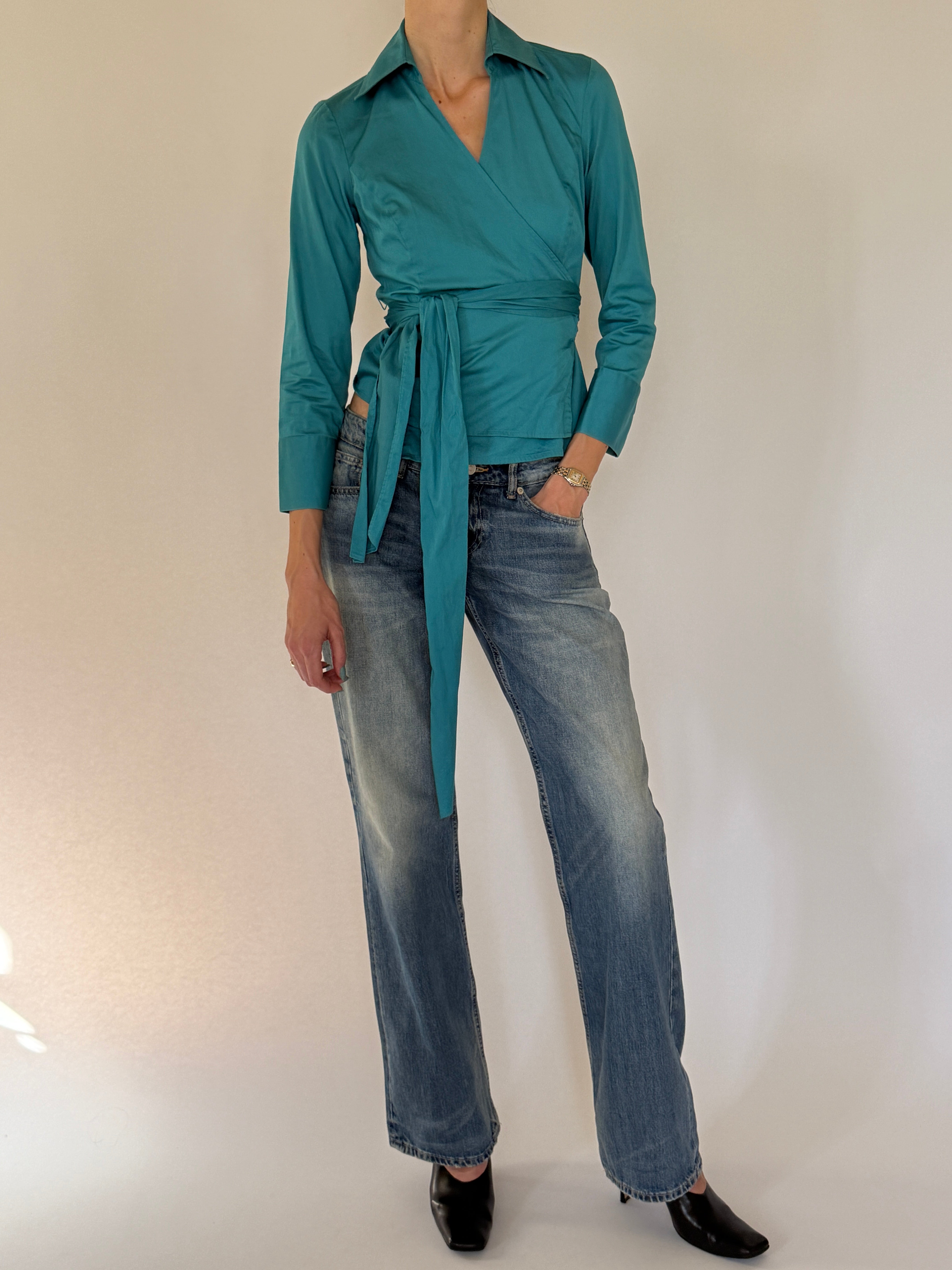 Vintage fitted wrap tie blouse worn with denim
