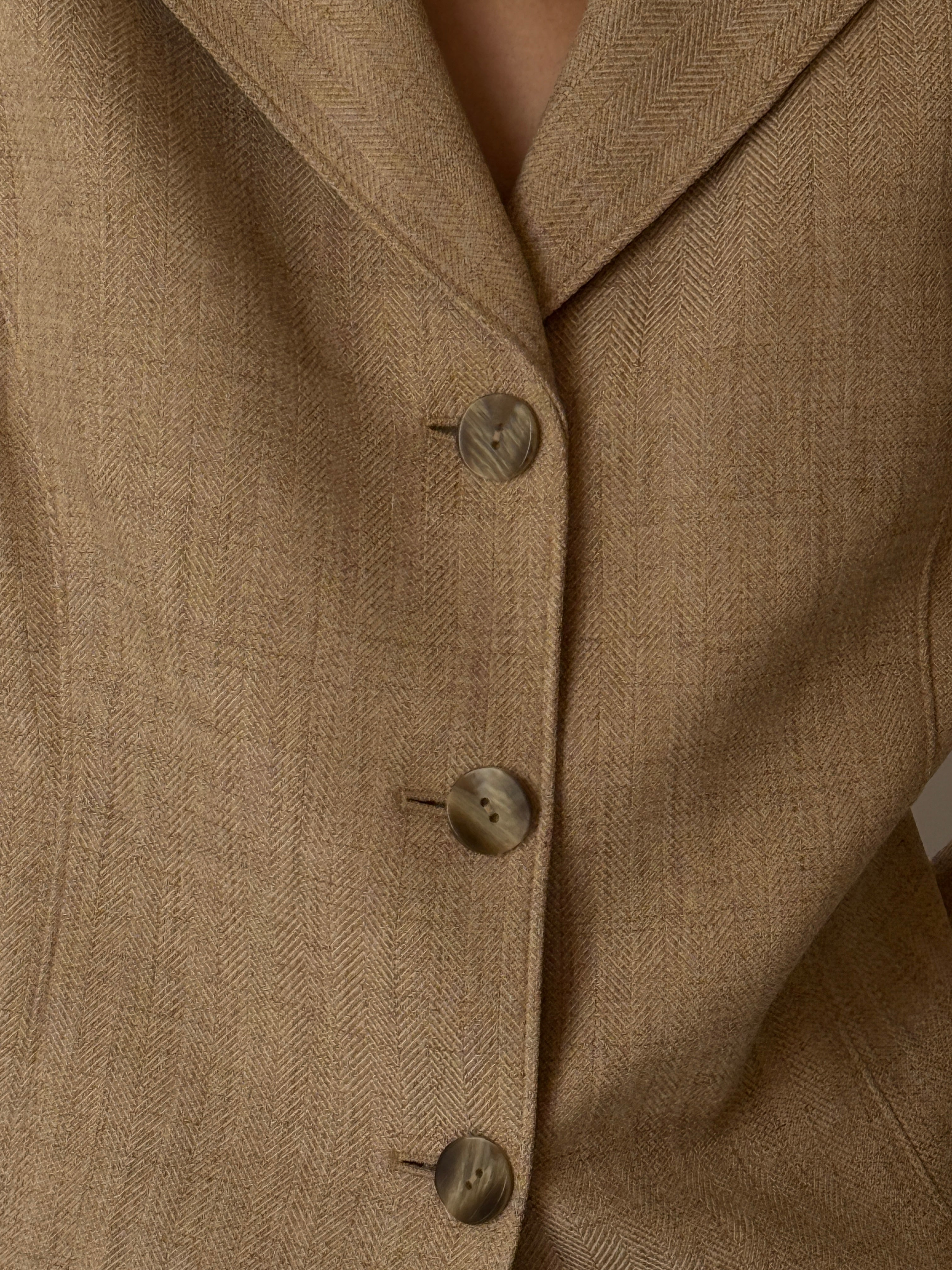 Detail of buttons on vintage tan blazer