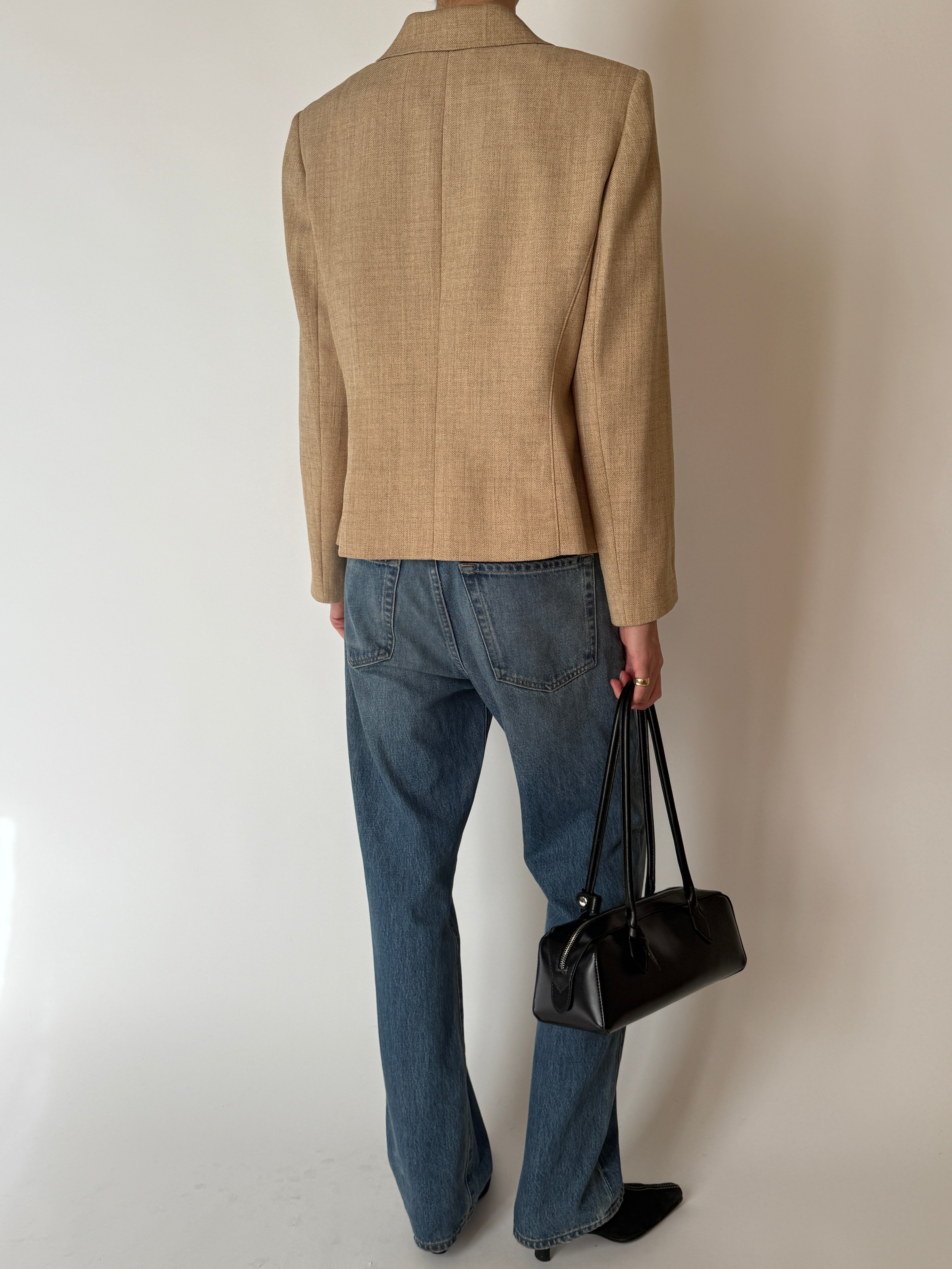 Back view of vintage tan herringbone blazer