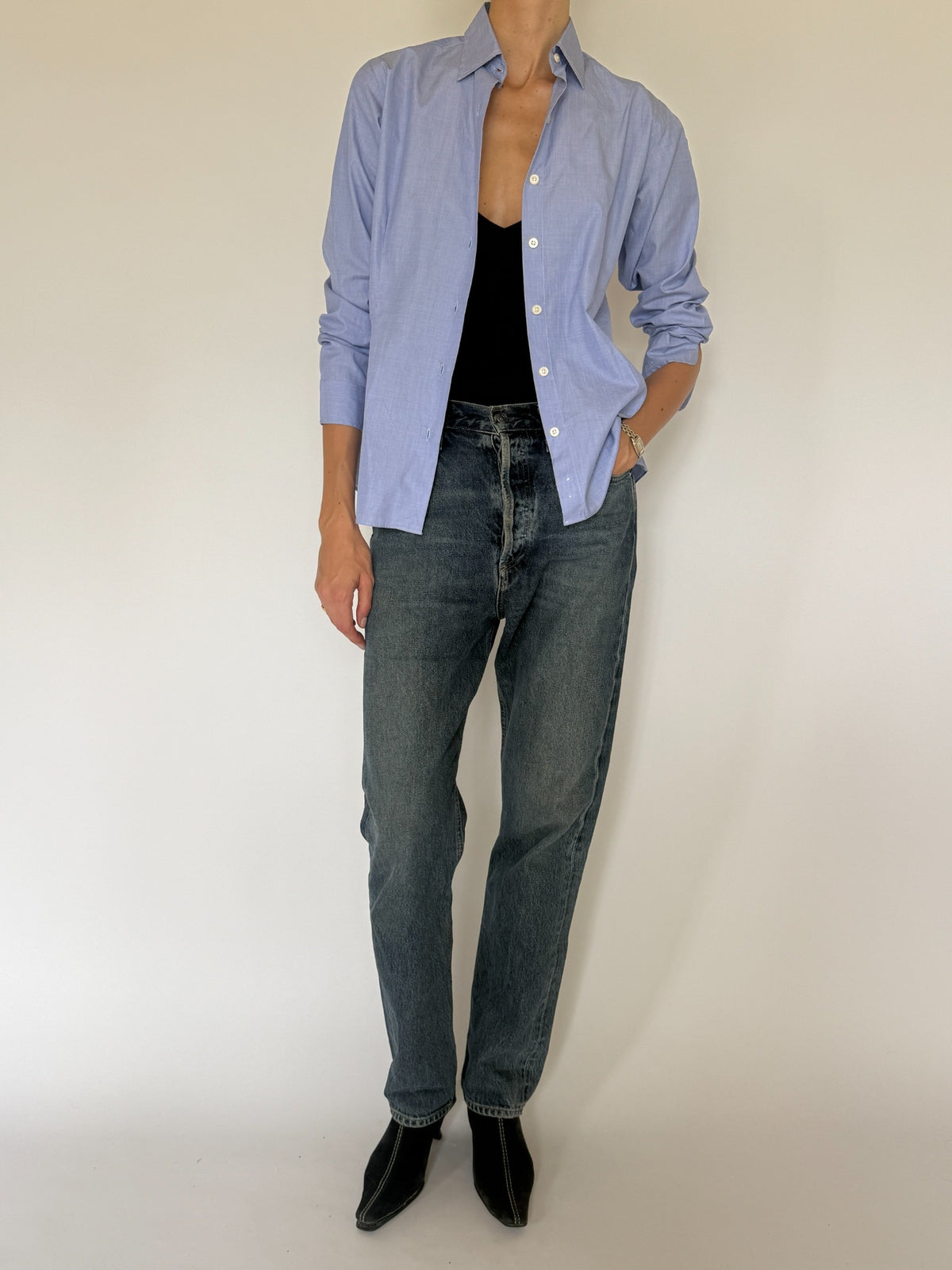 Front view of fitted light blue vintage button-up shirt