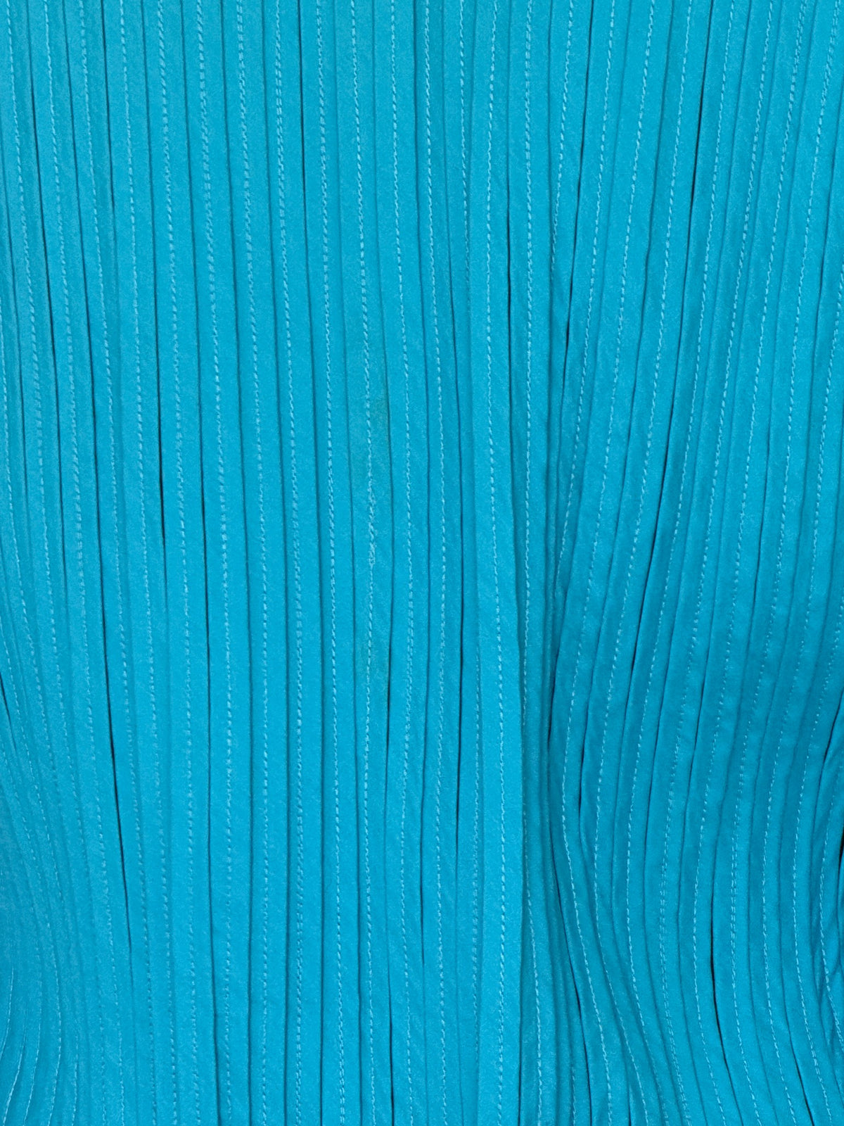 Vintage teal shirt pleated fabric close-up