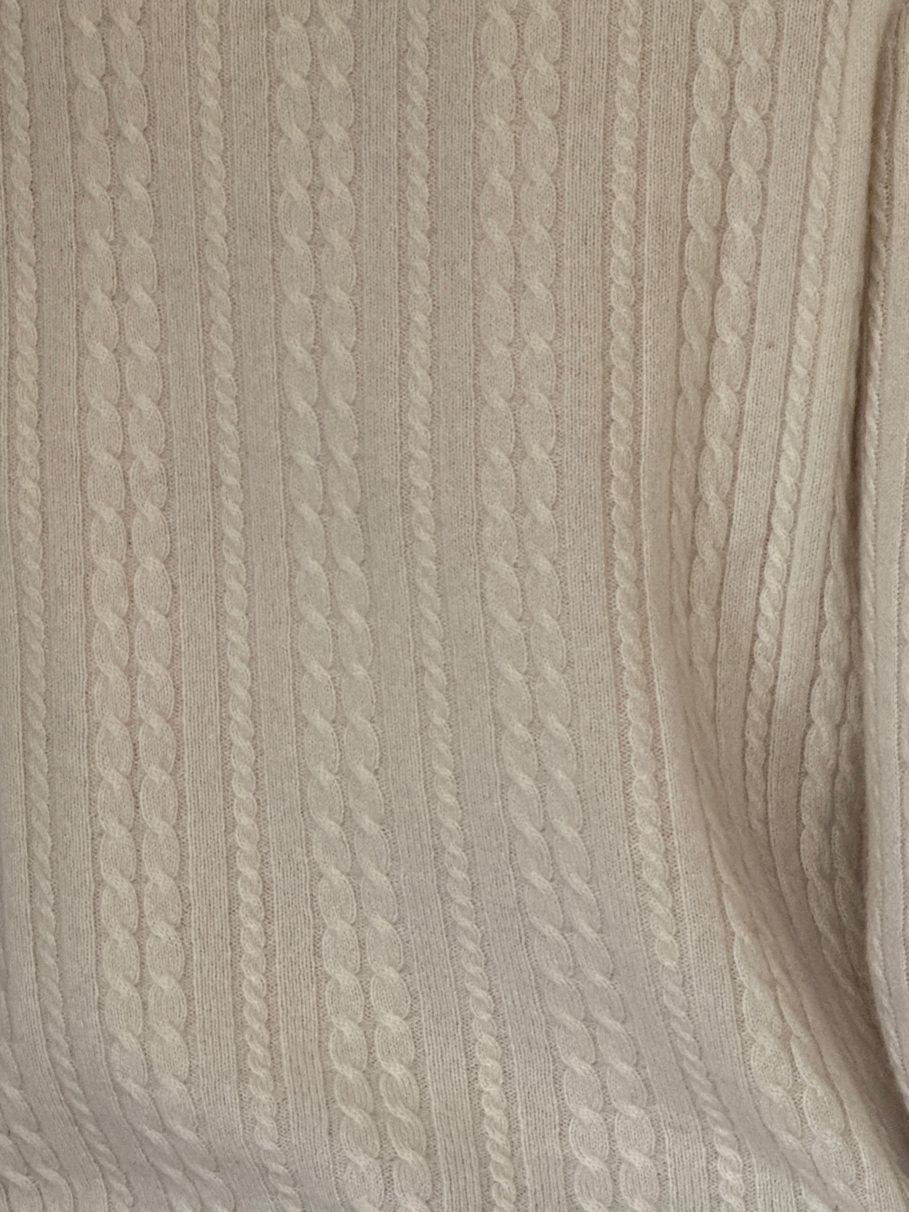 Vintage cream cashmere cable knit fabric close-up