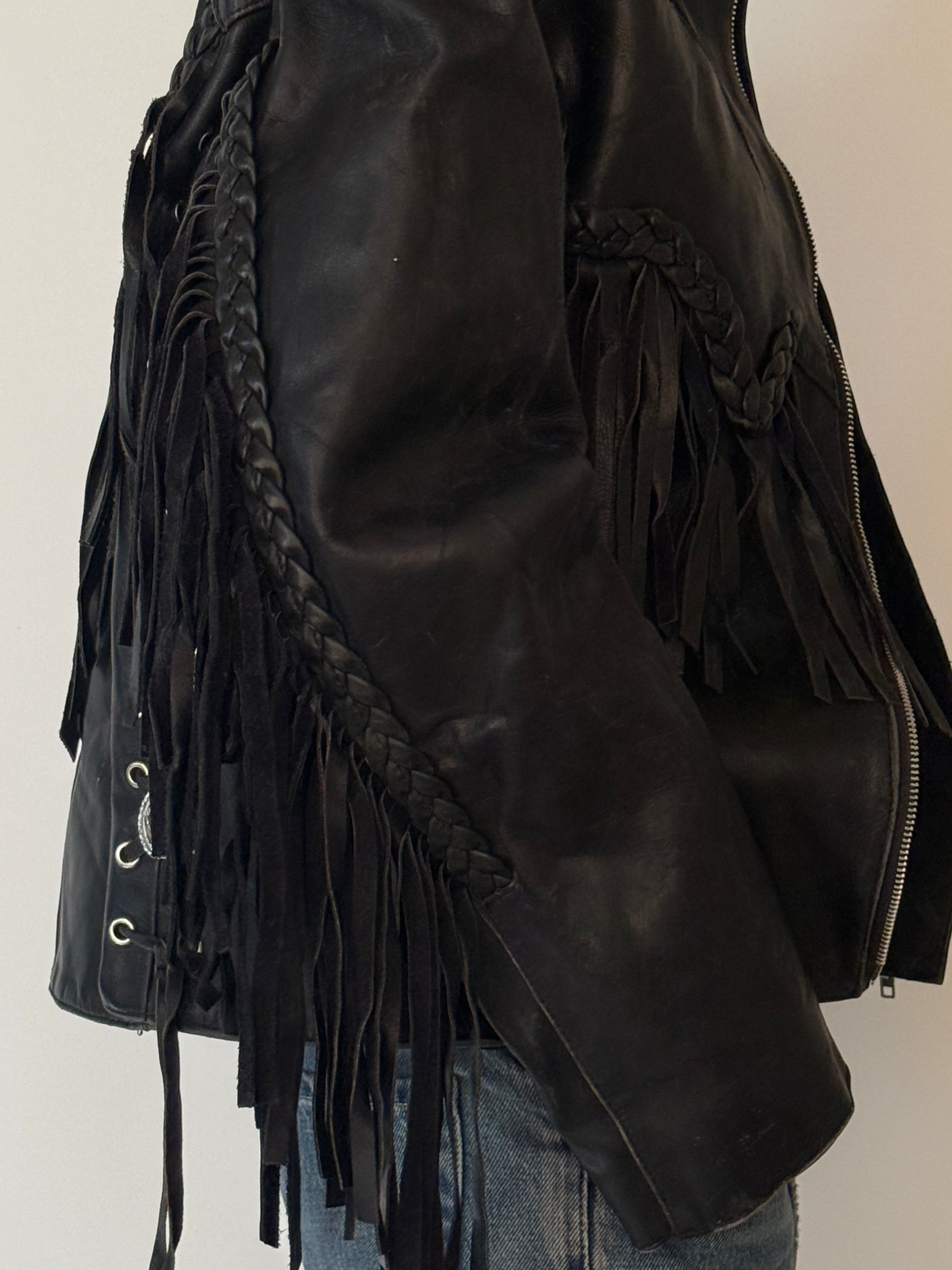 Vintage leather fringe jacket black side view close-up