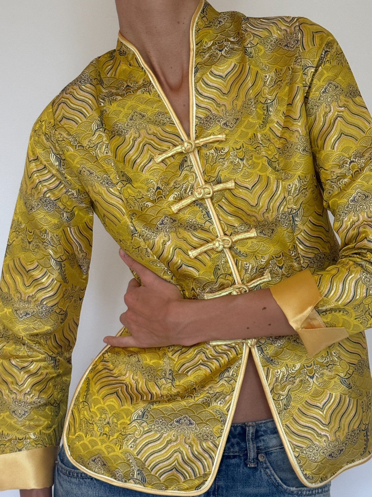 Vintage golden yellow brocade jacket side view with satin piping