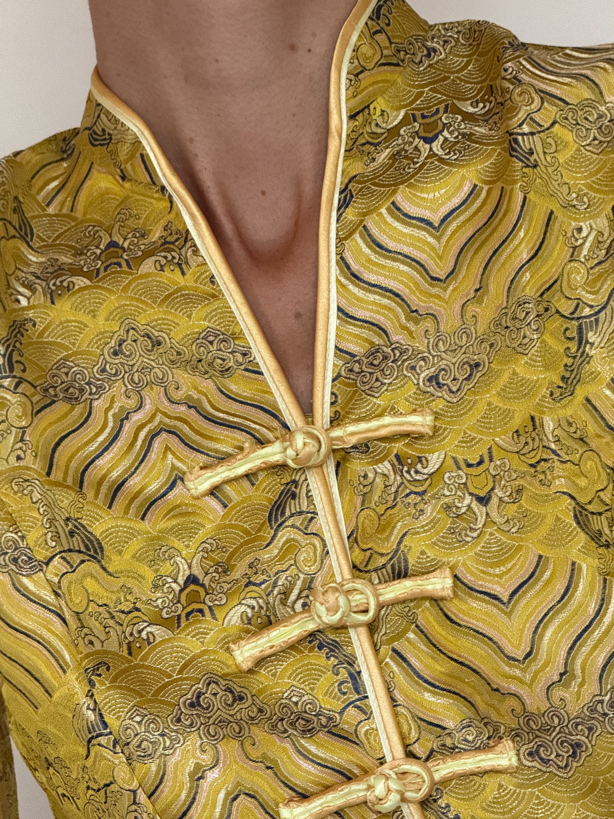 Vintage golden yellow brocade jacket frog closure detail