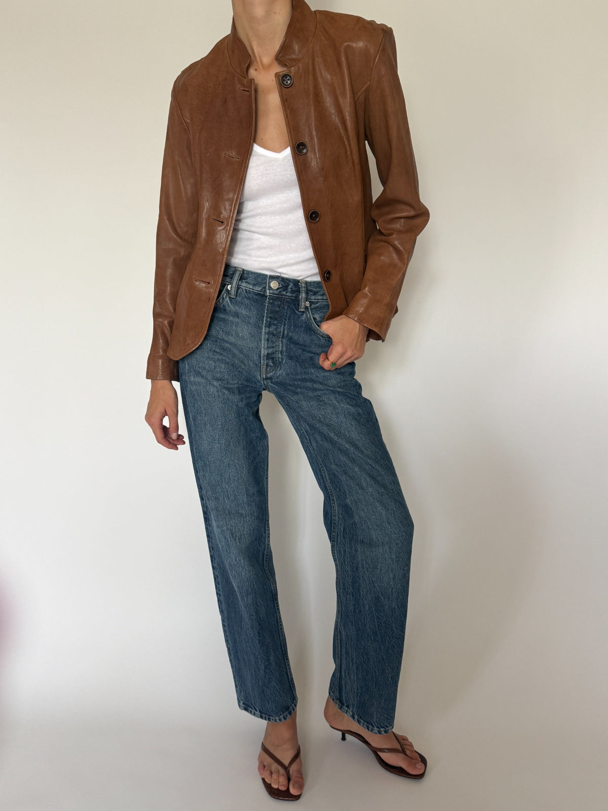 Vintage cognac leather jacket back seam detail