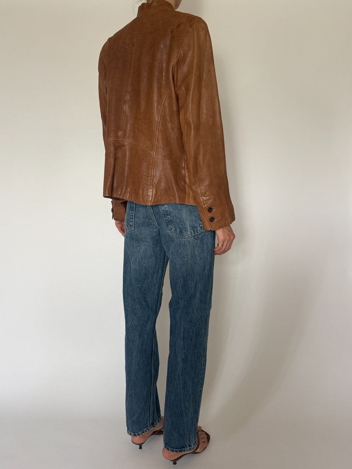 Vintage cognac leather jacket side view