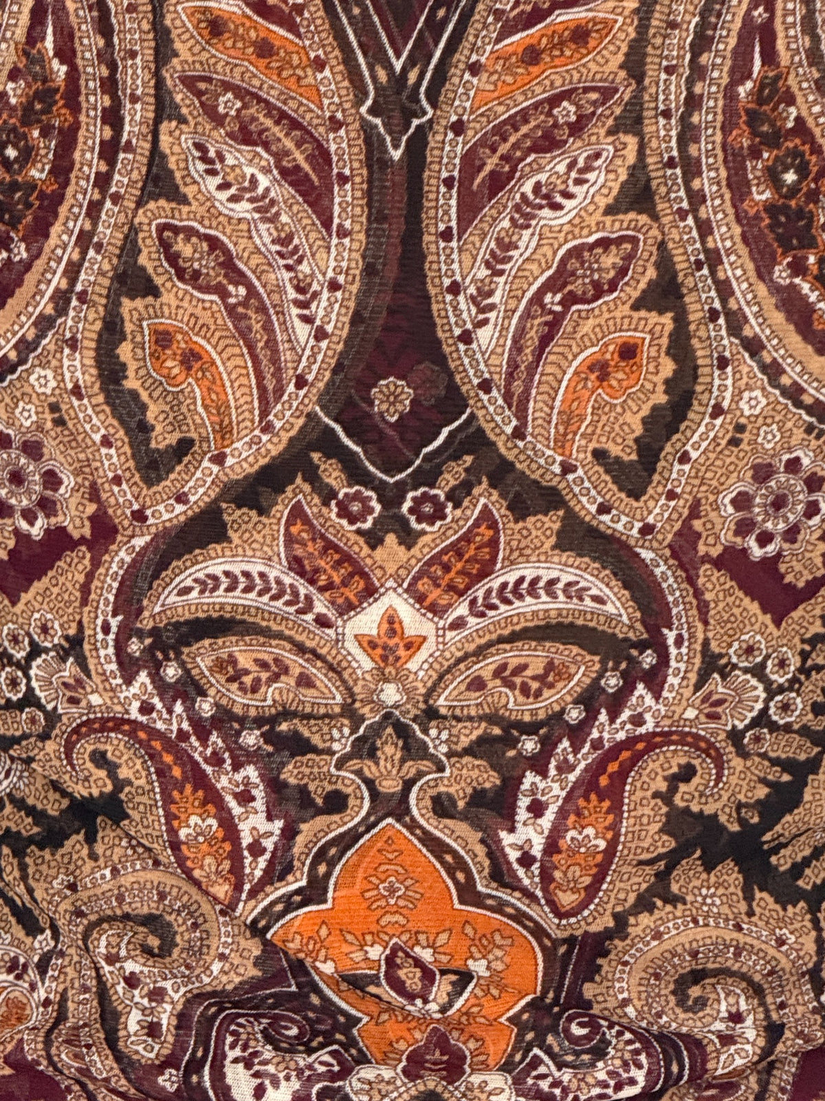 Vintage paisley top fabric close-up showing ornate burgundy, brown, black, tan and burnt orange pattern