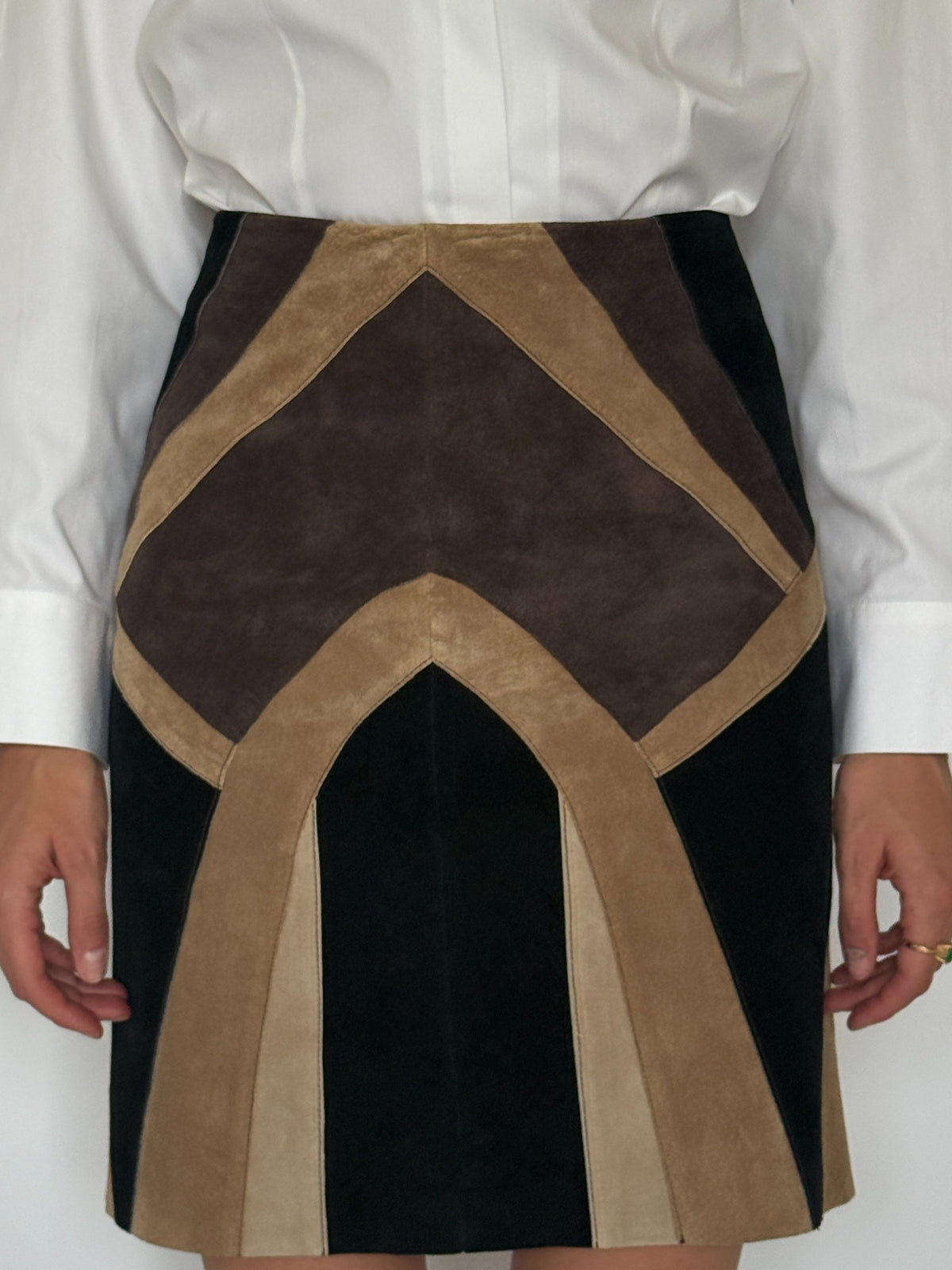 Vintage patchwork leather mini skirt side view showing paneled construction