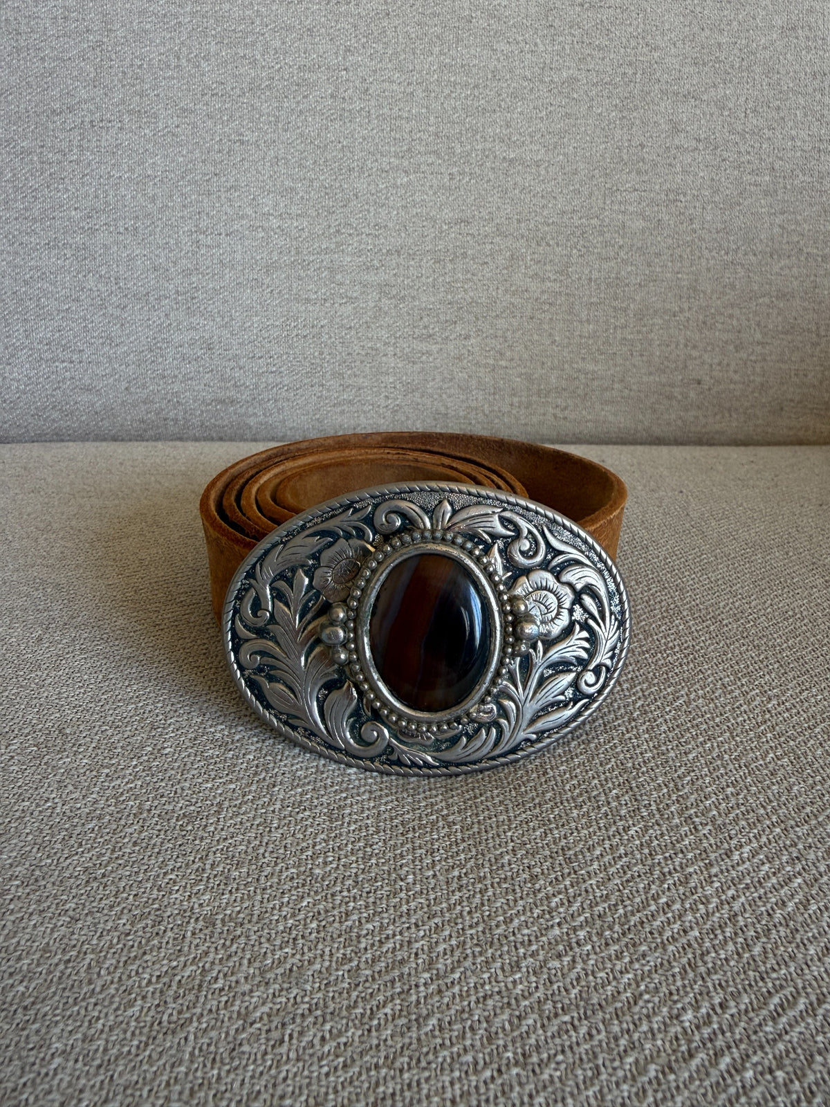 Vintage western belt brown front view with ornate oval buckle