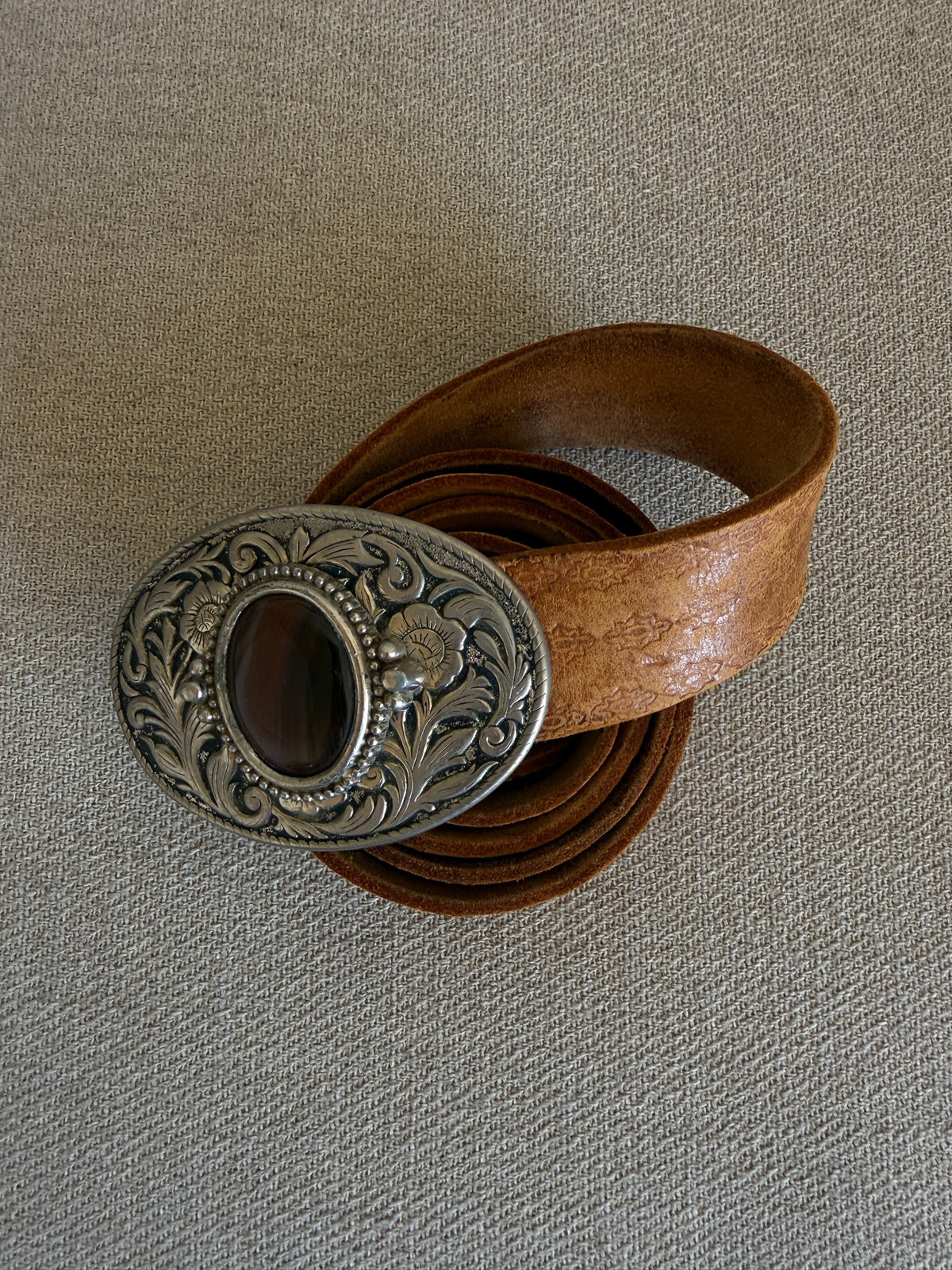 Vintage western belt brown angled view with statement buckle