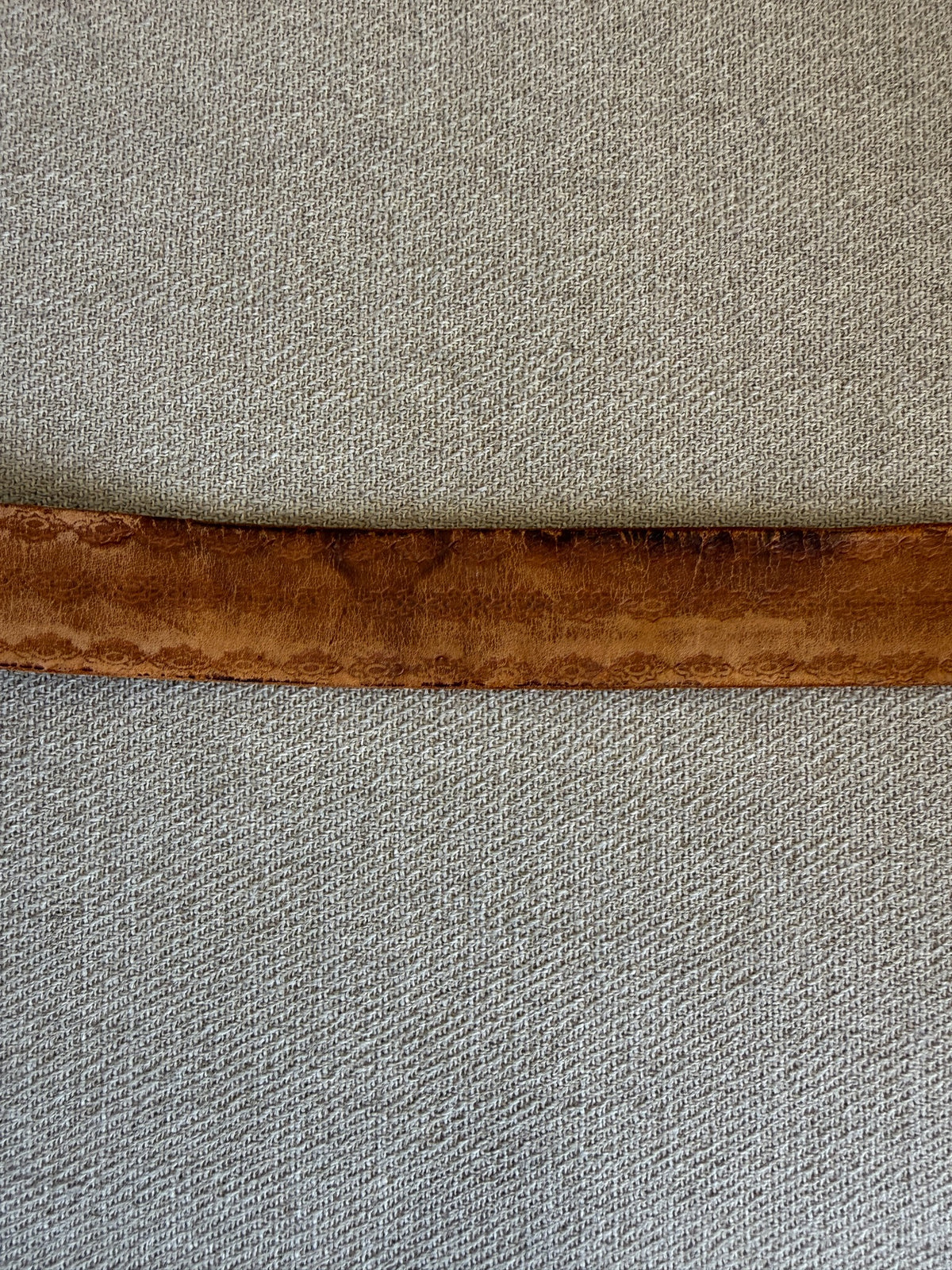 Vintage western belt brown close-up showing natural discoloration and wear