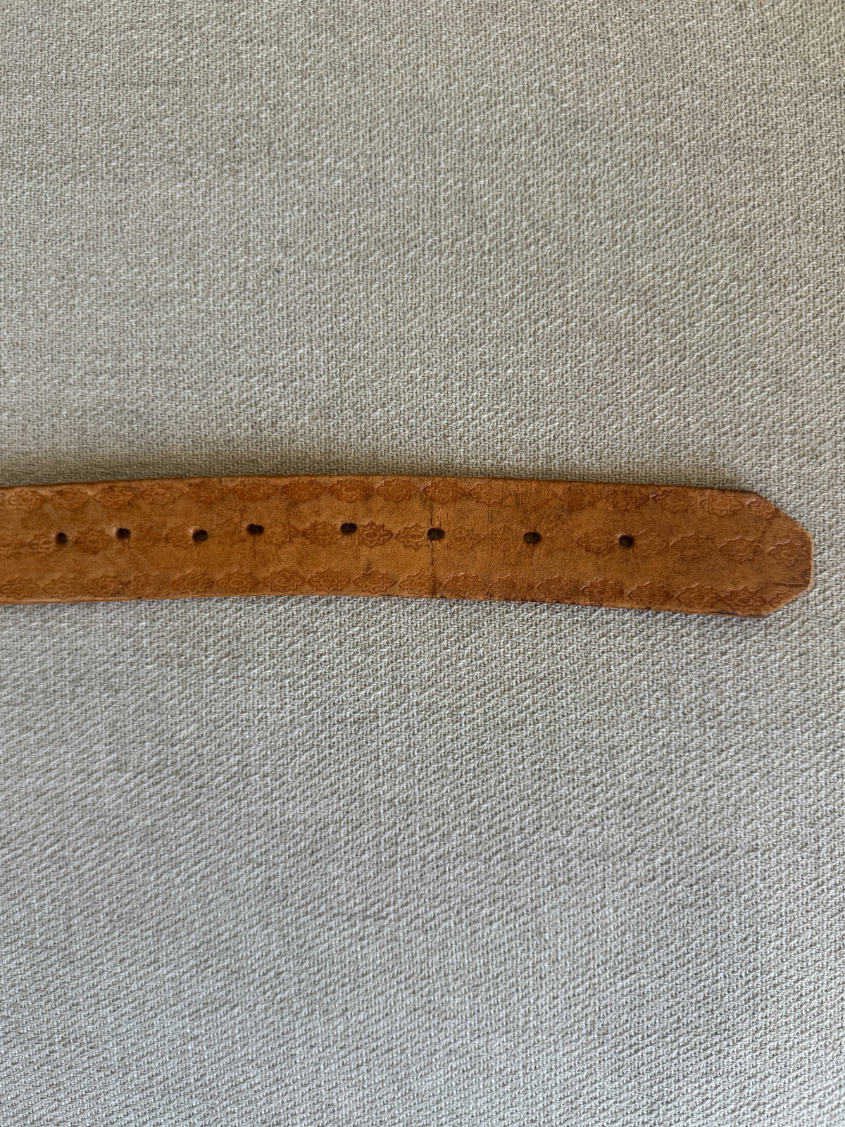 Vintage western belt brown strap and adjustment holes detail